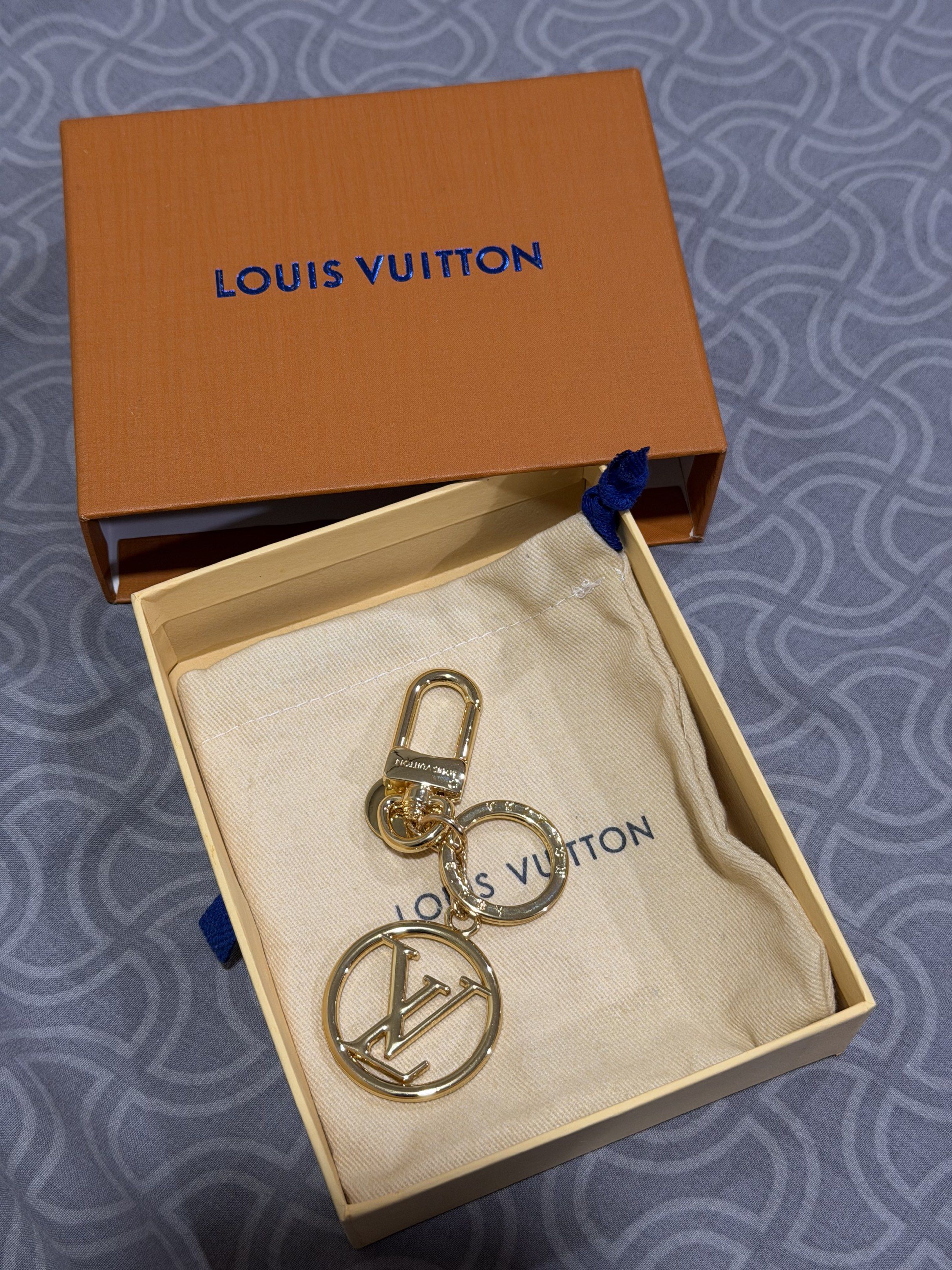Louis Vuitton Key Chain (Category: Luxury Accessories) located in Cebu City. Submitted by worthitsizzums (Listing ID 1418015715, Image 1). Description: - Louis Vuitton key chain - Features a gold-tone finish - Iconic LV logo - Includes original box and dust bag - Clasp for easy attachment - Stylish accessory.