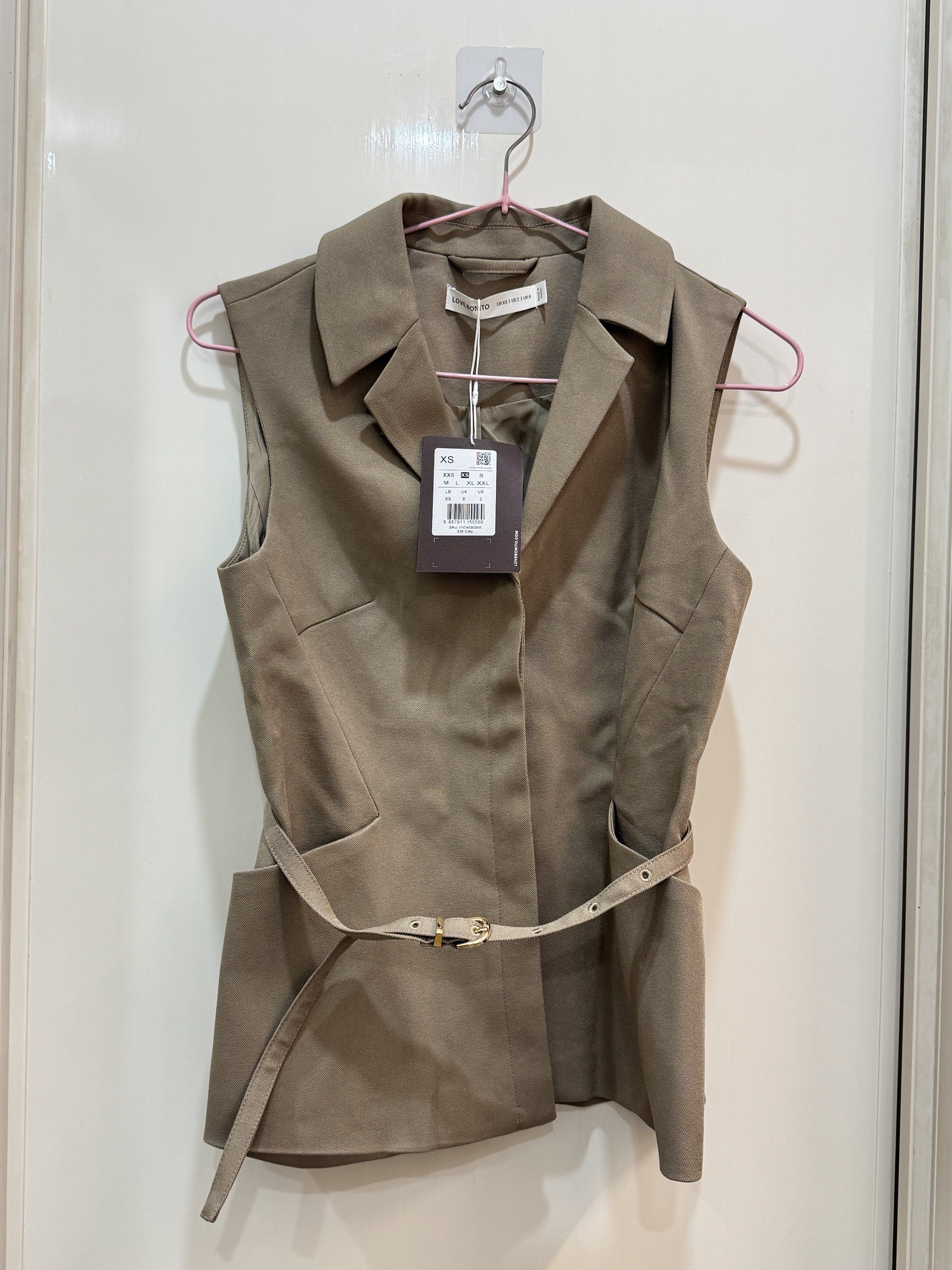 Love Bonito Ling Belted Tailored Vest NEW (Category: Blouses) located in Cavite. Submitted by shopizzy (Listing ID 1418190607, Image 2). Description: Brand New, still with tags Size: XS Color: Clay RFS: Extra Payment: GCASH / BPI Shipping: JNT or Buyer to book own delivery .
