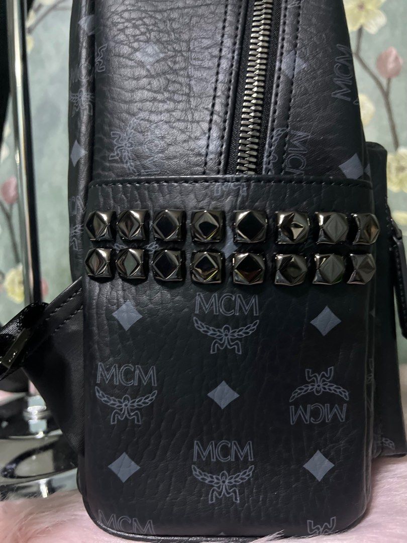 MCM Stark Side Studs backpack(negotiable) (Category: Luxury Bags & Wallets) located in Quezon City. Submitted by sherashley (Listing ID 1418185714, Image 2). Description: - MCM Stark Side Studs backpack in black Visetos coated canvass w/gunmetal hardware - Features the iconic MCM logo pattern - Stylish studded accents - embosed MCM, heat stamp & YKK Zip -The screw in the MCM logo is turnable - with MCM original dustbag - Perfect for everyday use 