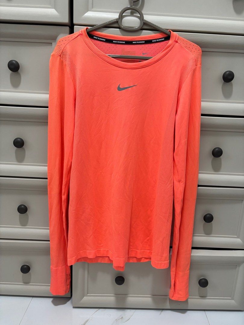 Nike Dri-FIT Running Shirt - Orange (Category: Activewear) located in Baguio. Submitted by usedcondition (Listing ID 1418113447, Image 1). Description: .