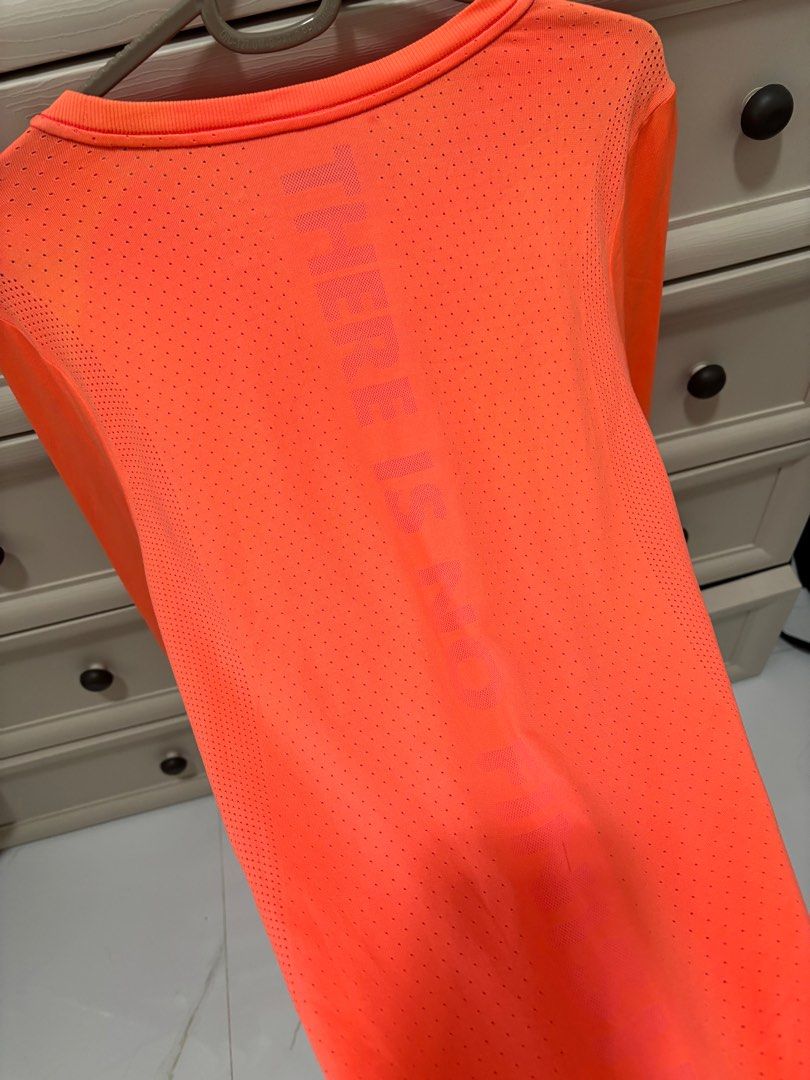 Nike Dri-FIT Running Shirt - Orange (Category: Activewear) located in Baguio. Submitted by usedcondition (Listing ID 1418113447, Image 2). Description: .