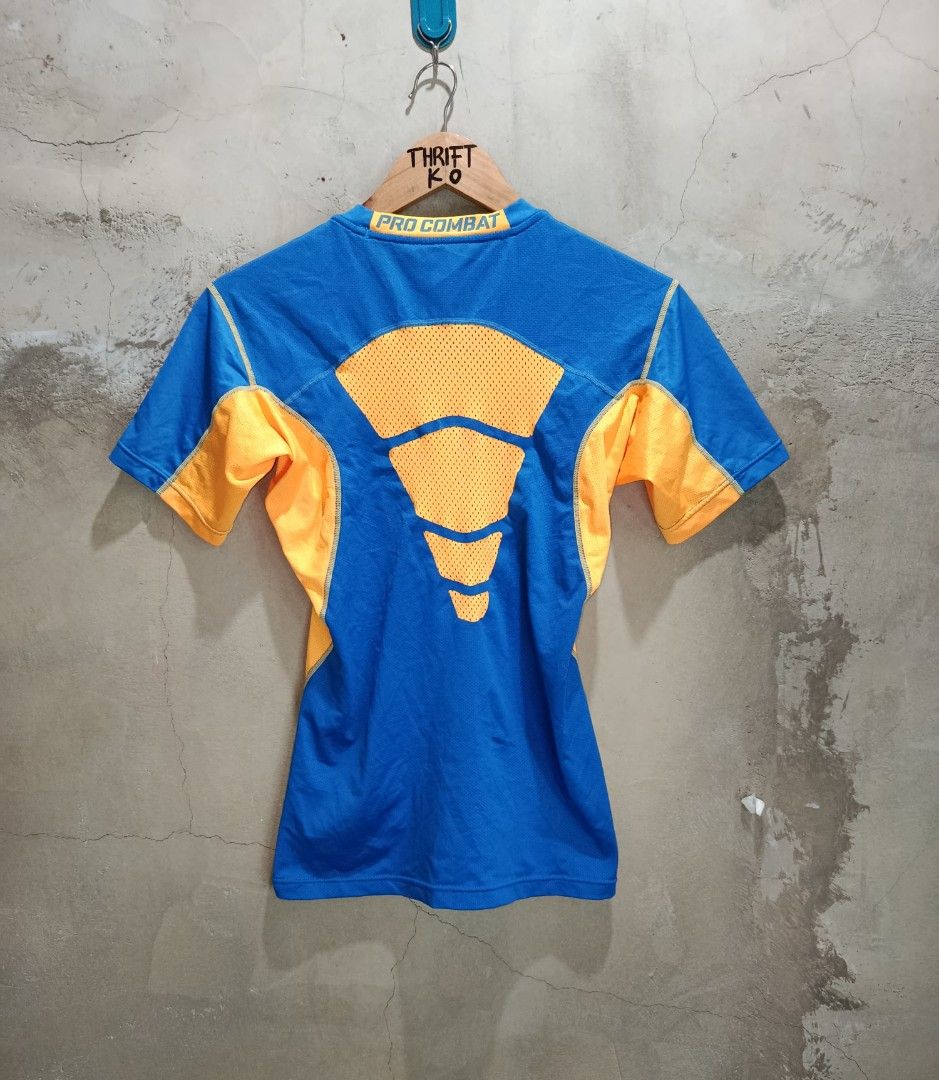Nike Pro Combat XL Shirt (Category: Activewear) located in Kalamansig. Submitted by skone1996 (Listing ID 1418093214, Image 2). Description: - Nike Pro Combat shirt - Color: Blue and orange - Size: XL - 16 Width - 27 Length - Crew neck, short sleeves - Nike logo on chest - Pro Combat branding on back and neckline - Dri-FIT technology.