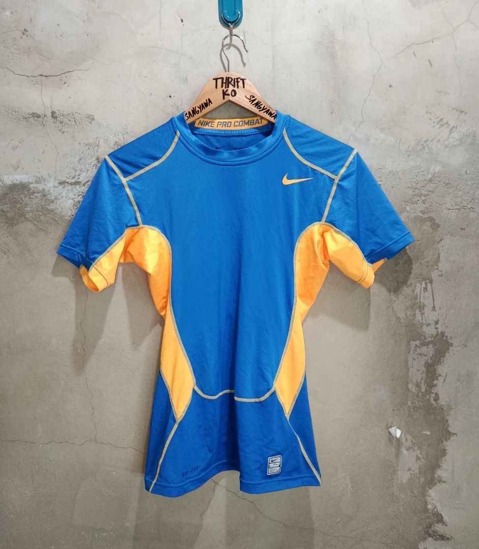 Nike Pro Combat XL Shirt (Category: Activewear) located in Kalamansig. Submitted by skone1996 (Listing ID 1418093214, Image 1). Description: - Nike Pro Combat shirt - Color: Blue and orange - Size: XL - 16 Width - 27 Length - Crew neck, short sleeves - Nike logo on chest - Pro Combat branding on back and neckline - Dri-FIT technology.