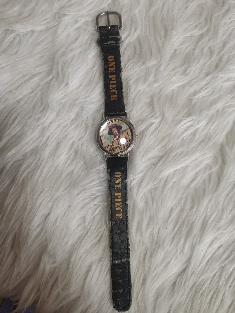 One Piece Ace Watch (Category: Men's Watches) located in General Mariano Alvarez. Submitted by ma.miafajardo1219 (Listing ID 1418077442, Image 2). Description: One Piece Ace Watch. Black strap with "ONE PIECE" print. Stainless steel back..