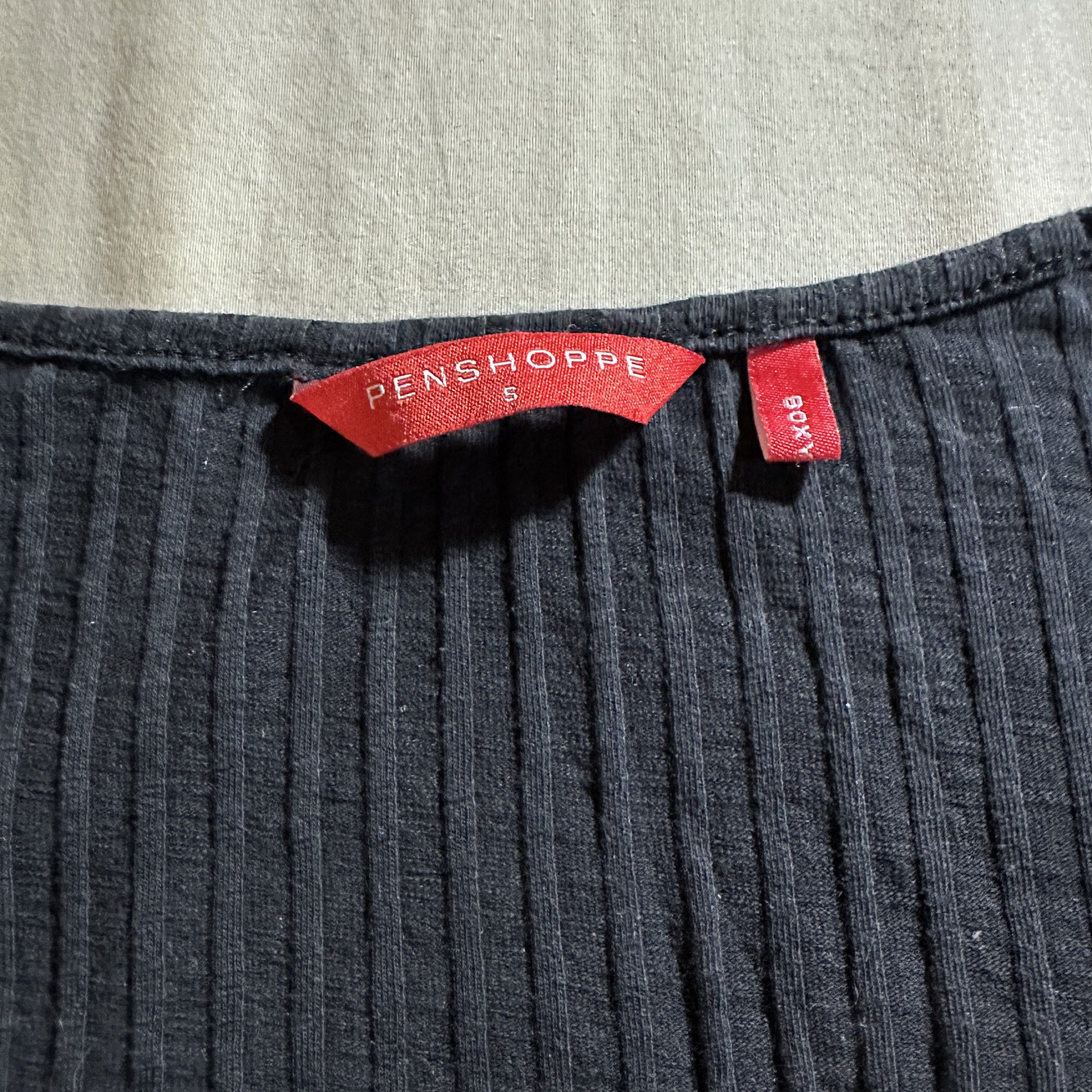 Penshoppe Ribbed Top (Category: Shirts) located in Baguio. Submitted by chaewos (Listing ID 1418125702, Image 2). Description: - Penshoppe top - Ribbed design - Scoop neckline - Button-down front - Three-quarter sleeves - Size: S - Color: Black .