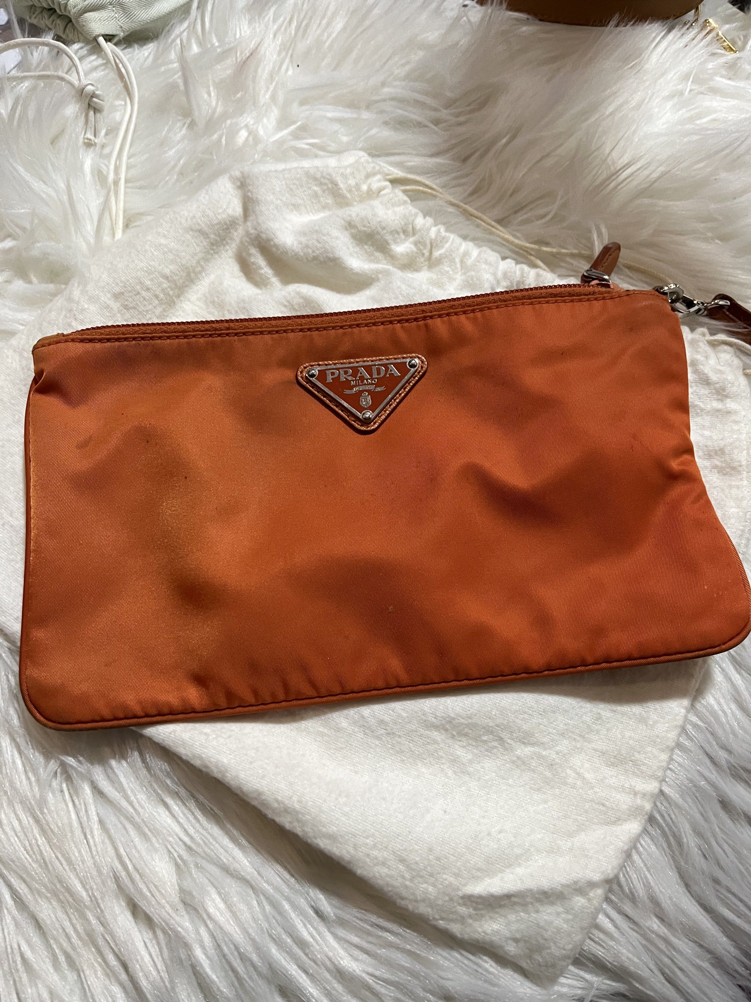 Prada Orange Clutch (Category: Luxury Bags & Wallets) located in Caloocan City. Submitted by stephanieannramos (Listing ID 1418193441, Image 2). Description: .