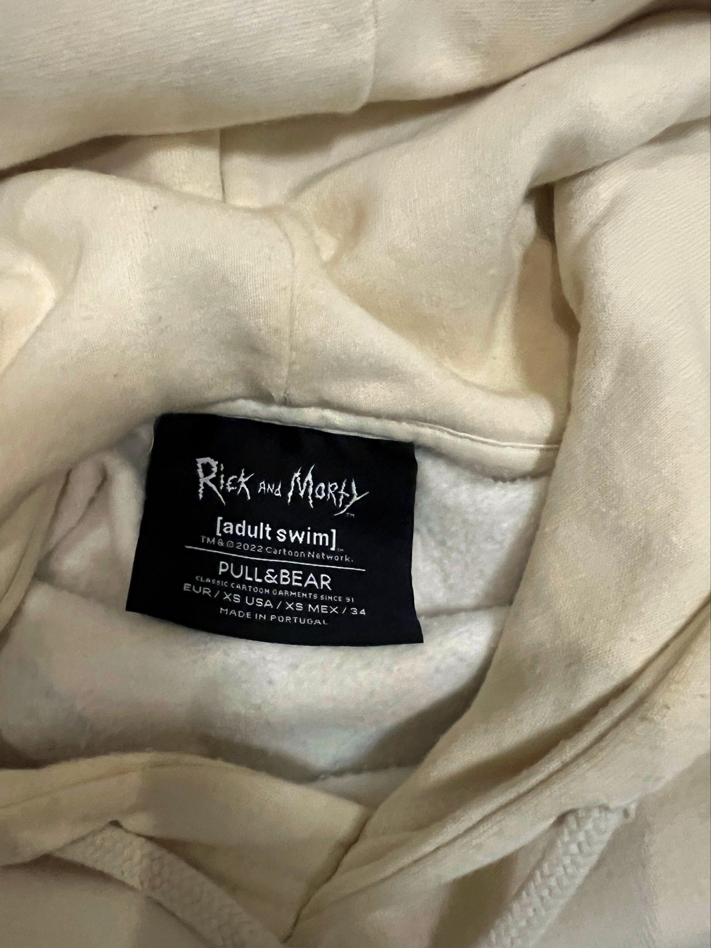 Pull&Bear Rick and Morty Hoodie (Category: Hoodies) located in Antipolo. Submitted by mja_salvador (Listing ID 1418130737, Image 3). Description: - Cream-colored hoodie - Features a Rick and Morty design - Show logo on the front - Rick graphic on the back - Kangaroo pocket - Drawstring hood - Brand: Pull&Bear - Size: XS/S.