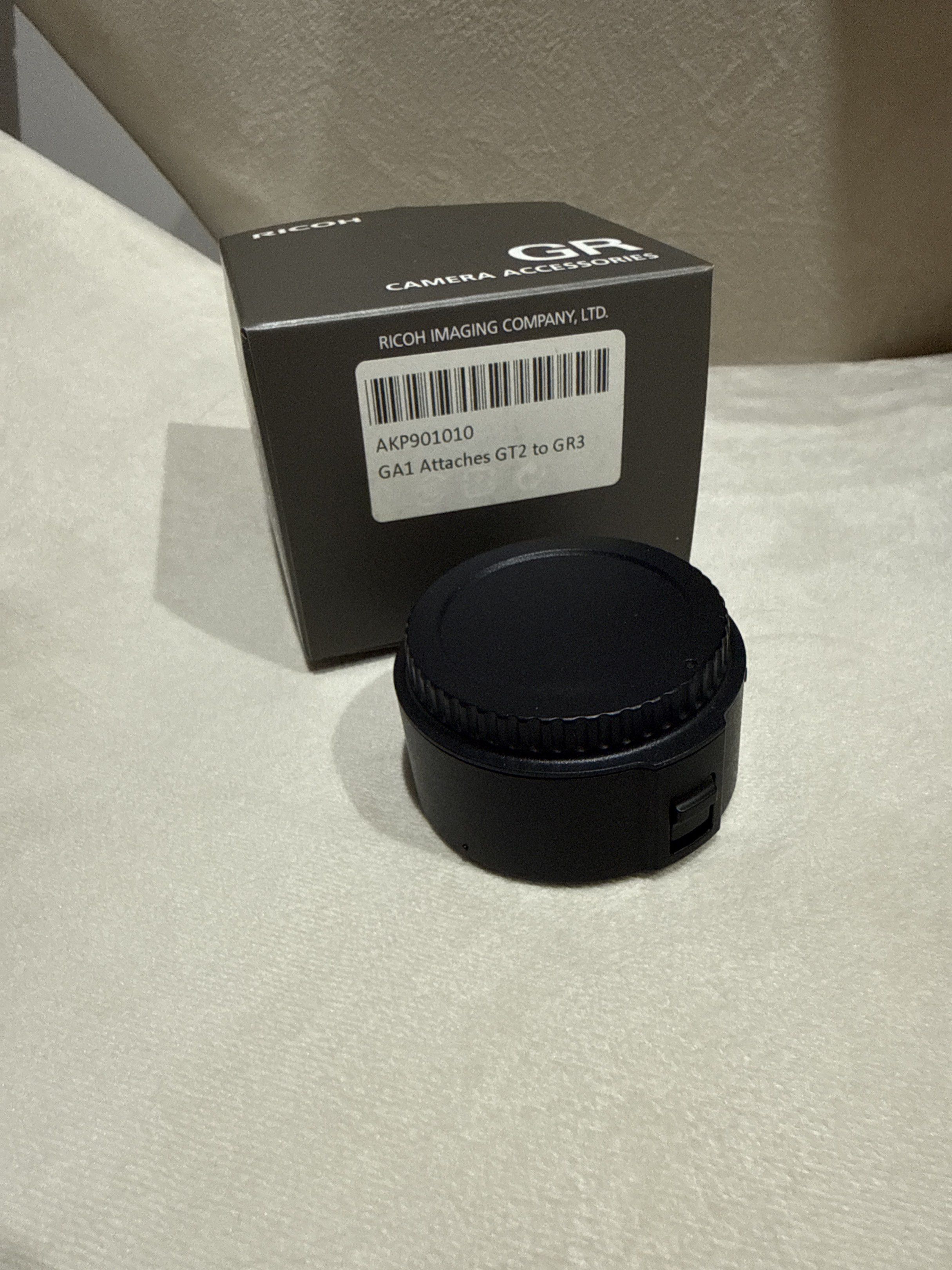 Ricoh GR GA-1 Adapter (Category: Cameras) located in Caloocan City. Submitted by tidyhome.ph (Listing ID 1418178076, Image 2). Description: - Genuine Ricoh GA-1 adapter - For GRIII cameras - Includes original box - Color: Black.