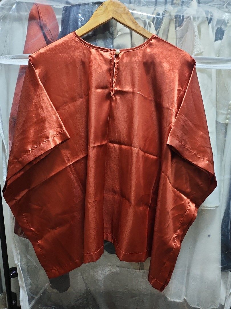 Rust satin nursing cover (Category: Maternity wear) located in Quezon City. Submitted by declttermum (Listing ID 1418112800, Image 2). Description: Preloved stylish rust satin nursing cover/poncho, free size. Can be used as top. Wysiwyg. #satinnursingcover #nursingcover #nursingponcho.