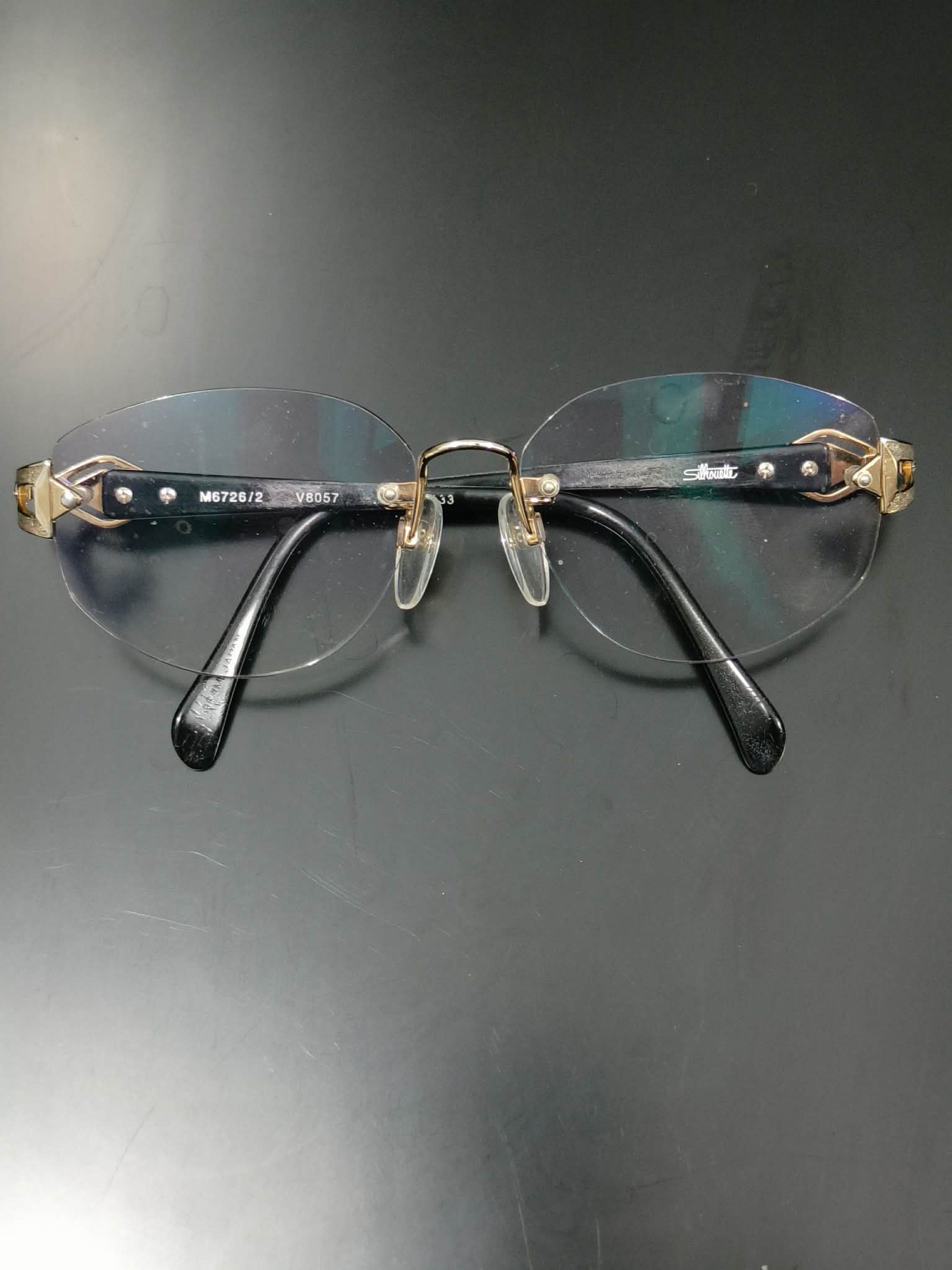 Silhouette V8057 Eyeglasses (Category: Sunglasses & Eyewear) located in Bacoor. Submitted by faith.hope.love28 (Listing ID 1418018204, Image 1). Description: - Elegant Silhouette eyeglasses - Rimless design with gold accents - Color: Black and gold - Model: M6726/2 and V8057 - Size: 133 - Lenses: Clear.
