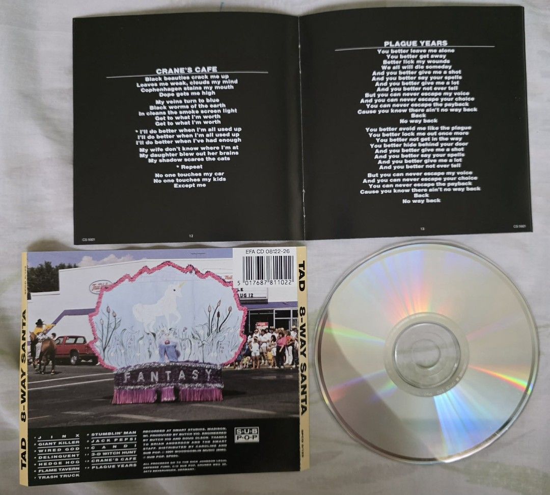 Tad - 8-Way Santa (Category: CDs & DVDs) located in Cebu City. Submitted by g_roshamboo (Listing ID 1418166327, Image 3). Description: Original CD of Tad's album "8-Way Santa". Includes the CD, the jewel case, and the booklet with lyrics. Features songs like "Giant Killer", "Wired God", and "Plague Years". The CD is from Sub Pop Records..