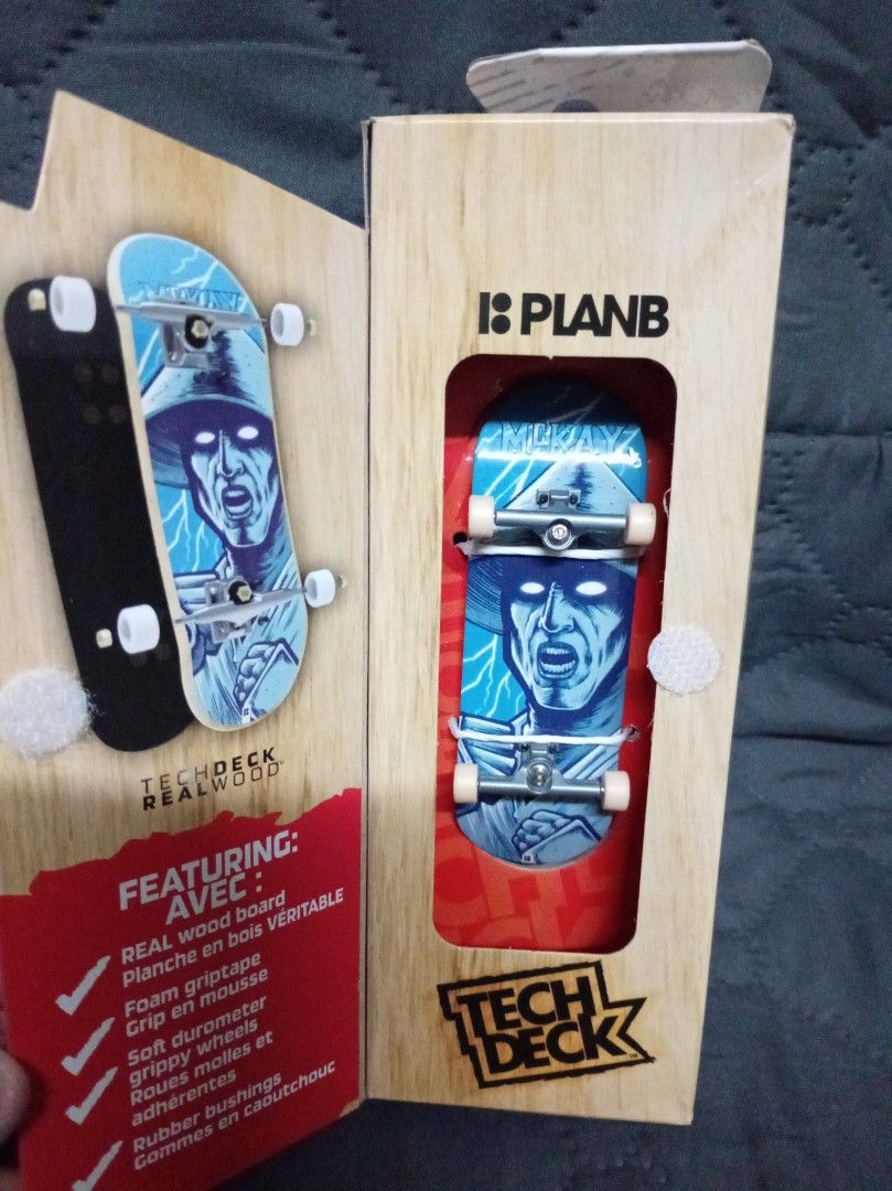 Tech Deck Plan B Fingerboard (Category: Action & Battle Toys) located in Cainta. Submitted by miggysabalboro1571 (Listing ID 1418081978, Image 1). Description: Tech Deck fingerboard features a Plan B design. It has a real wood board, foam grip tape, soft durometer grippy wheels, and rubber bushings. The fingerboard is part of the Performance Series and is suitable for ages 6+. The box shows the fingerboard's design and features..