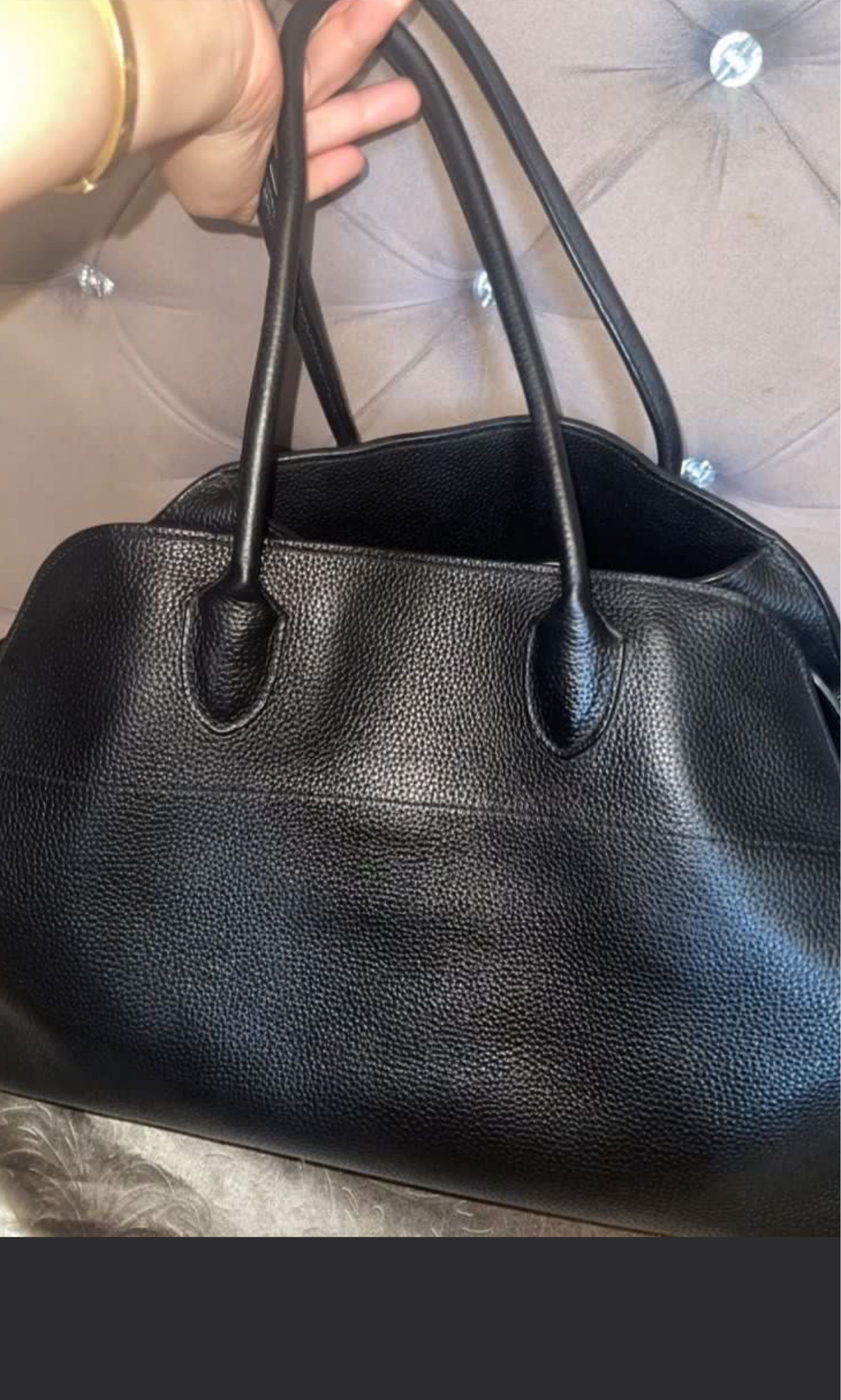 The Row Margaux Leather Handbag (Category: Luxury Bags & Wallets) located in Roxas City. Submitted by lynngreyartillero (Listing ID 1418118320, Image 3). Description: - The Row blackleather handbag - Structured design - Top handles - Interior strap with buckle - Spacious interior - Made of high-quality leather - The Row logo visible inside Preloved source/Ukay source Pm sa offer May sign if used pero walang major flaws pls manage your expectation