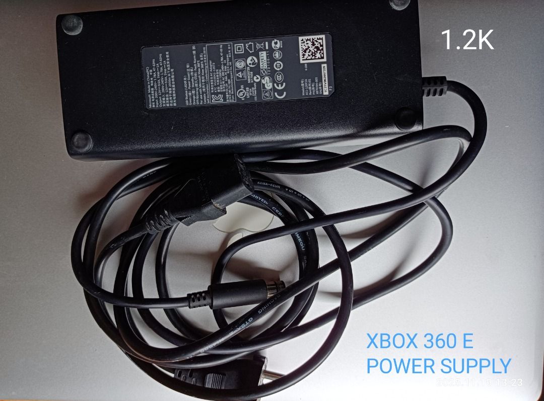 Xbox 360 E Power Supply (Category: Xbox) located in Butuan. Submitted by reggex99 (Listing ID 1418094771, Image 2). Description: Original power supply for Xbox 360 E. Includes the power brick and power cable. The power supply has various safety certifications and specifications printed on the label. It is ready to plug and use. RFS: The console is broken. Can do meetups if you are around in Butuan City (available time 5:00pm-6:00pm) Can also do s