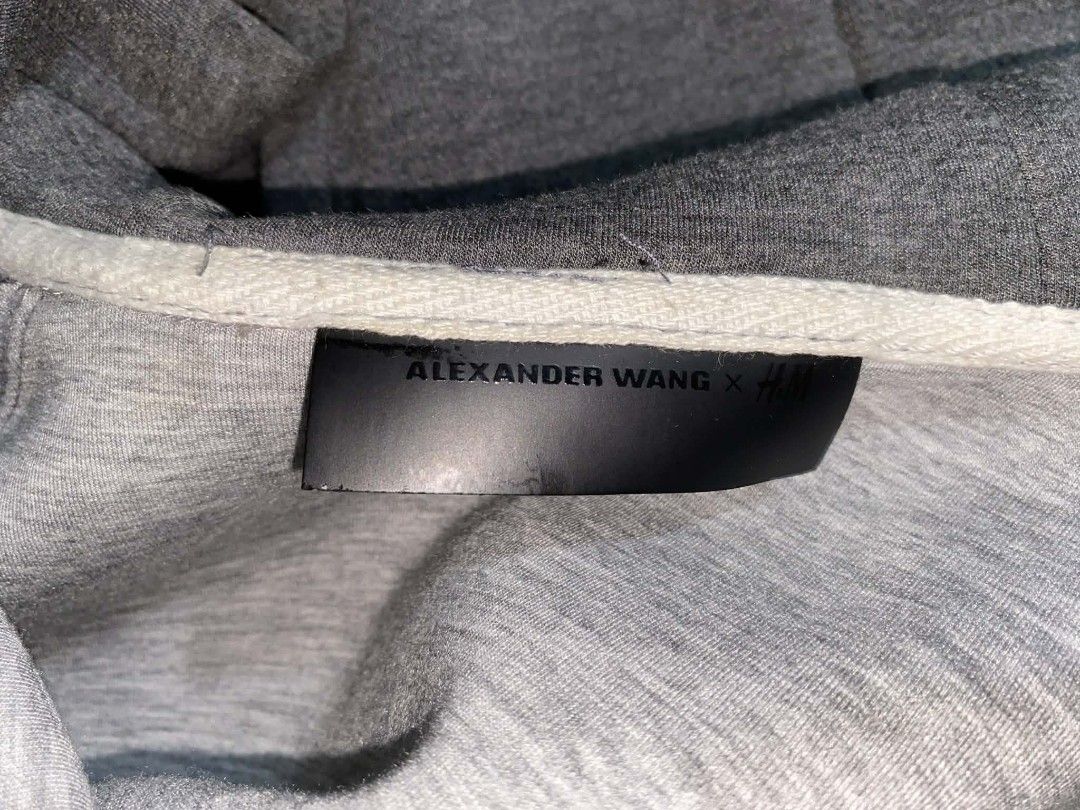 Alexander Wang x H&M Hoodie (Category: Coats, Jackets and Outerwear) located in Taguig. Submitted by tan0115 (Listing ID 1418266110, Image 3). Description: Honest Issue: Yung sa rubber ng zipper yung iba may unting punit. LP na po. No tawad na please..