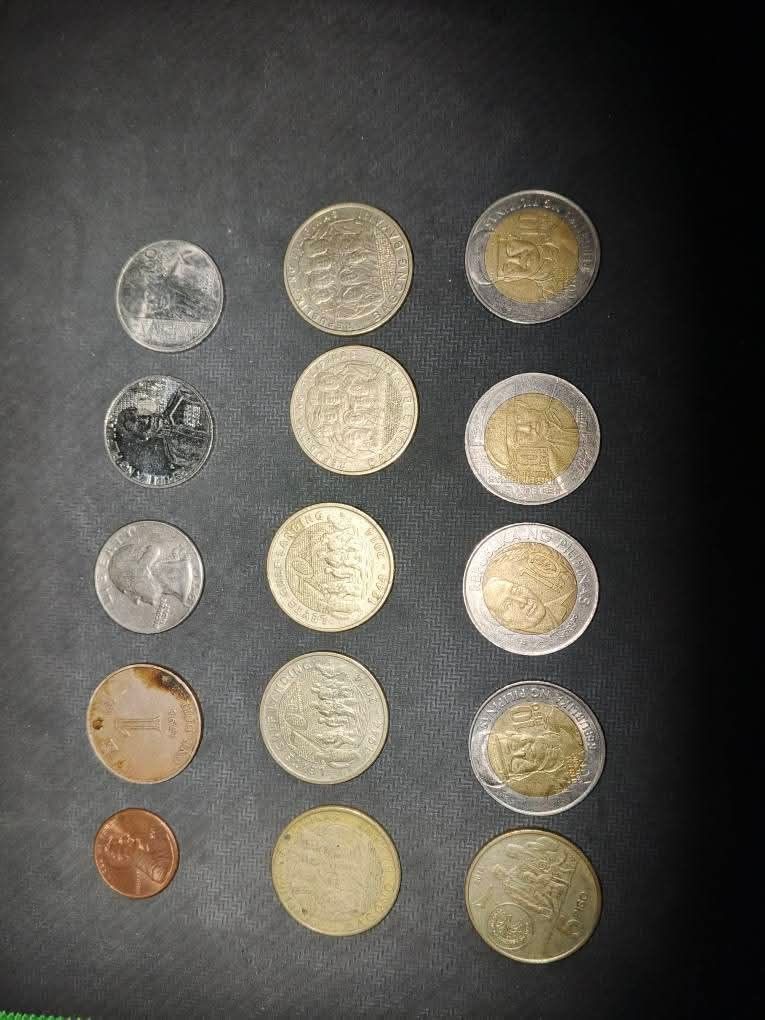 Assorted Coins (Category: Currency) located in Muntinlupa City. Submitted by jfkscjskckdkkcksoc (Listing ID 1418381129, Image 1). Description: - Assorted collection of foreign coins and commemorative coins. - Includes various denominations and designs. - Coins from different countries and eras. - Perfect for coin collectors and numismatics enthusiasts. - Please note: exact origin and value of each coin are unknown..