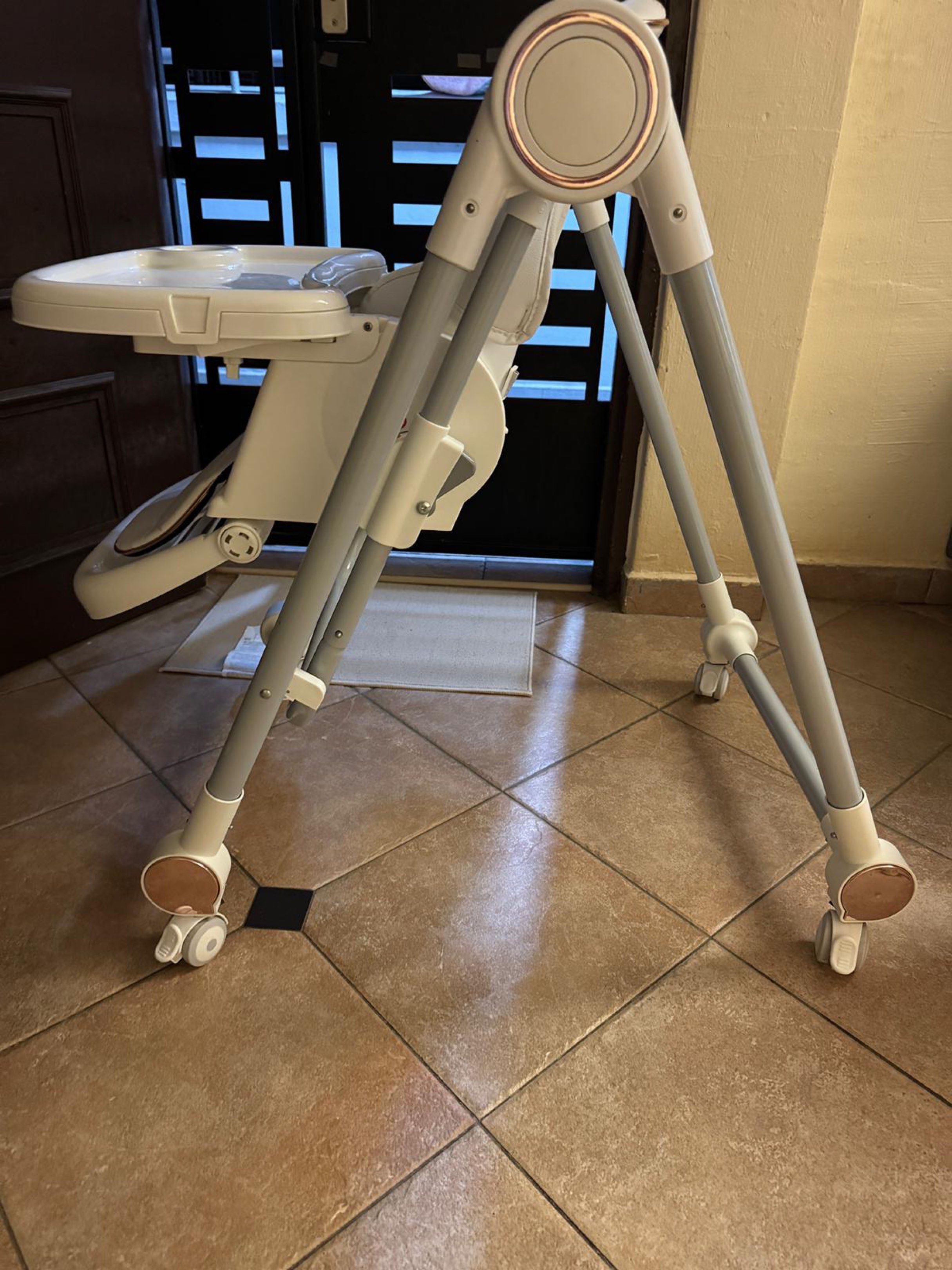 Baby High Chair - Adjustable, Foldable (Category: Baby High Chairs) located in Singapore. Submitted by thewardroberevival (Listing ID 1418312816, Image 3). Description: Features a removable tray, adjustable height, and a secure harness for safety. The chair is also foldable for easy storage. Wheels allow for easy movement around the house. Back adjustable incline Arrange for self delivery Negotiable .