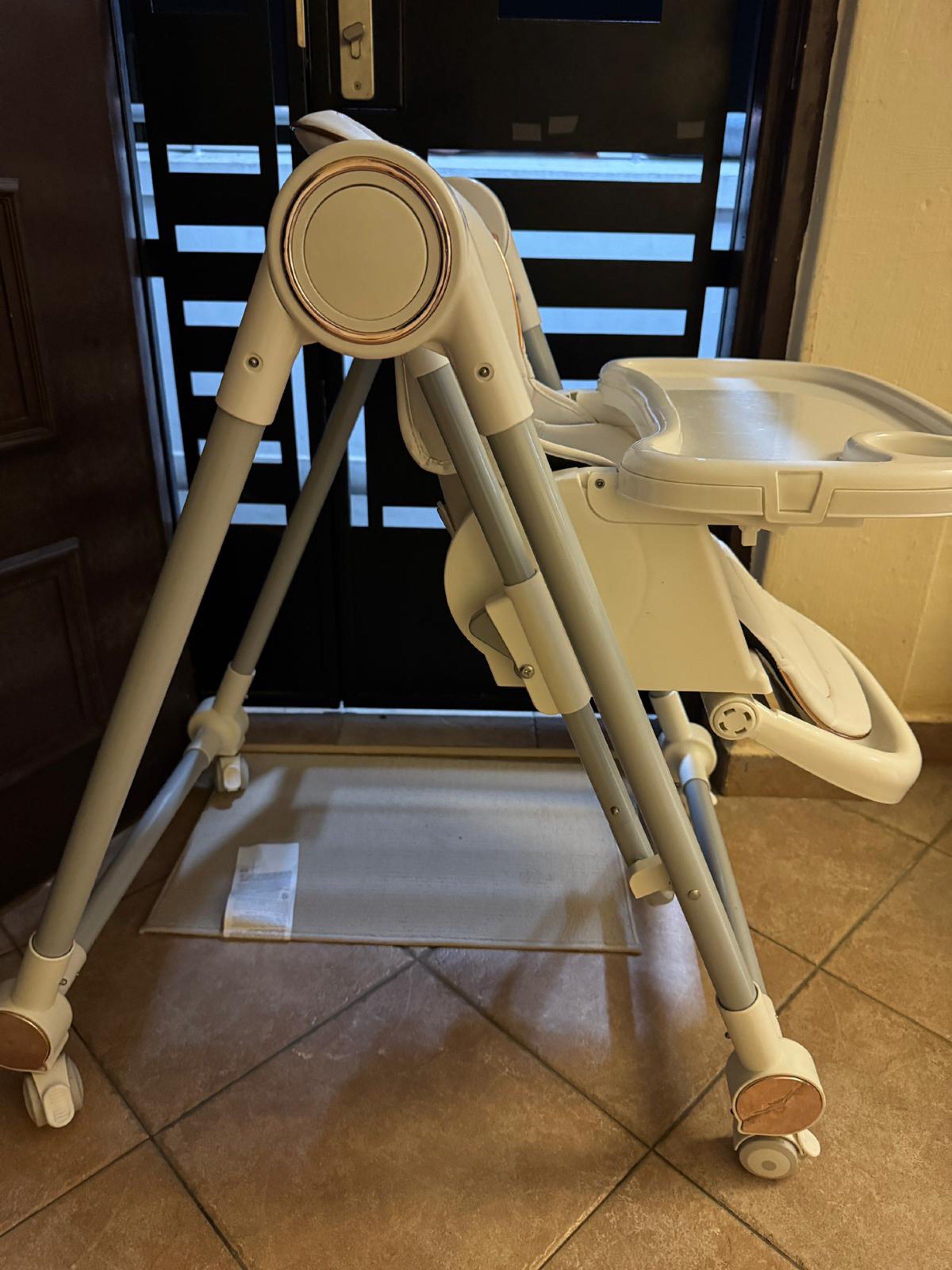 Baby High Chair - Adjustable, Foldable (Category: Baby High Chairs) located in Singapore. Submitted by thewardroberevival (Listing ID 1418312816, Image 2). Description: Features a removable tray, adjustable height, and a secure harness for safety. The chair is also foldable for easy storage. Wheels allow for easy movement around the house. Back adjustable incline Arrange for self delivery Negotiable .