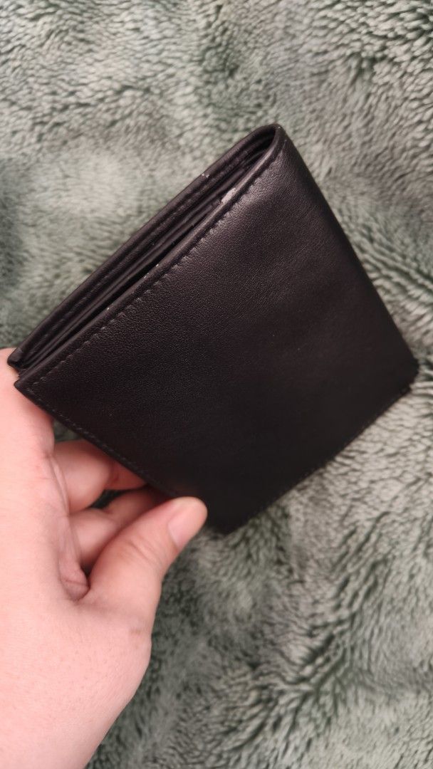 Black Leather Wallet (Category: Wallets & Card holders) located in Tanza. Submitted by declutterolshoppe (Listing ID 1418251350, Image 2). Description: - Black leather wallet - Multiple card slots - Clear ID window - Secure snap closure - Smooth leather - Simple, classic design - Ideal for daily use - Compartments for cards and cash.
