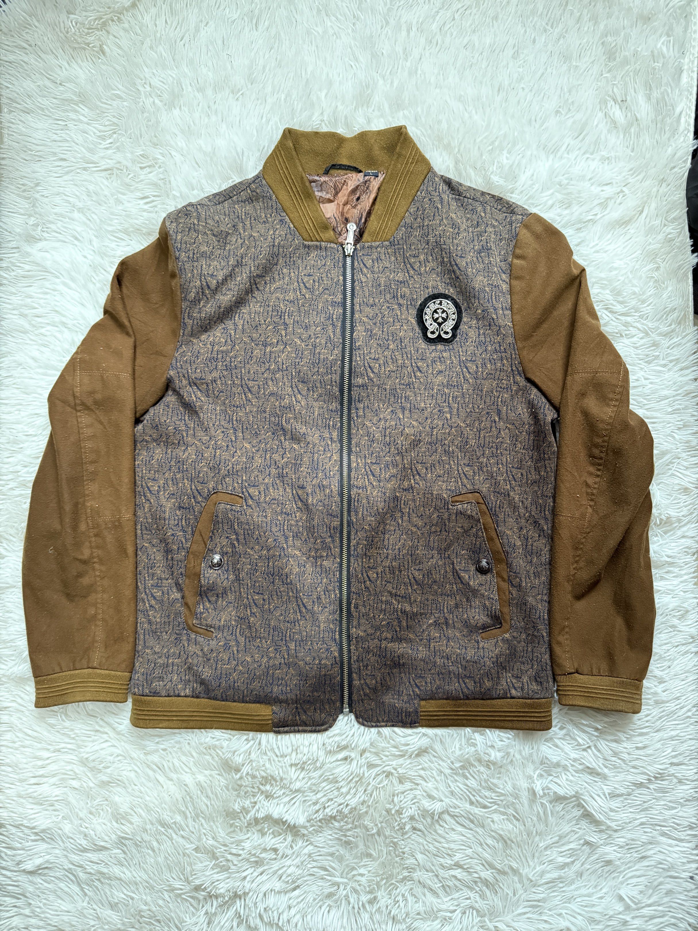 Bomber Jacket with Patch (Category: Coats, Jackets and Outerwear) located in Manila. Submitted by keepercollection (Listing ID 1418209909, Image 1). Description: - Stylish bomber jacket - Unique patterned design - Brown sleeves and collar - Full zipper closure - Two front pockets - Decorative chest patch - Paisley-patterned lining - Size: L.