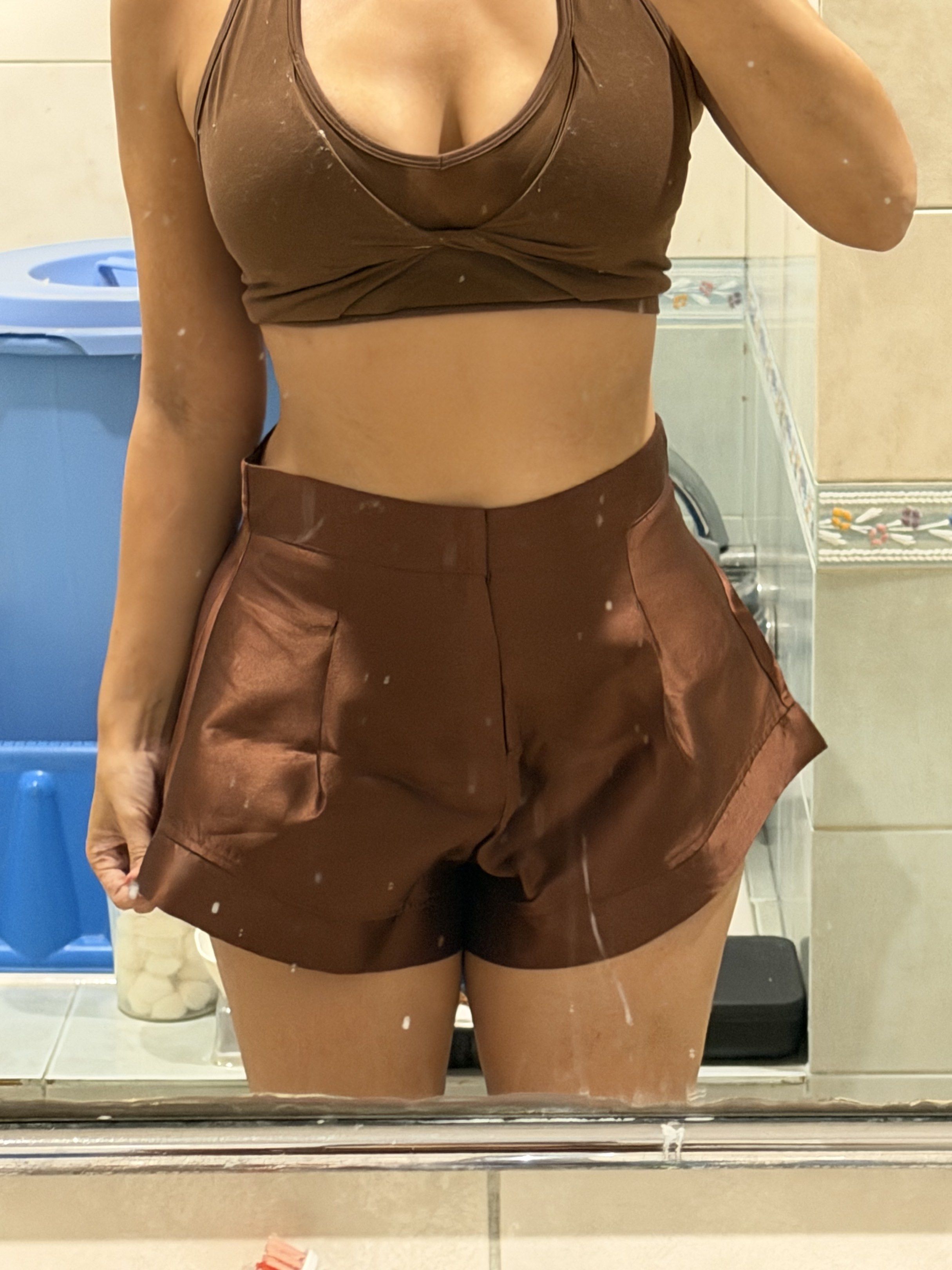 Brown Satin High-Waisted Shorts (Category: Shorts) located in Del Monte. Submitted by bren.lim (Listing ID 1418324380, Image 2). Description: Elegant brown satin high-waisted shorts. Features a flattering design with pleats at the front Cute for y2k styling Fits 27-28 waist .