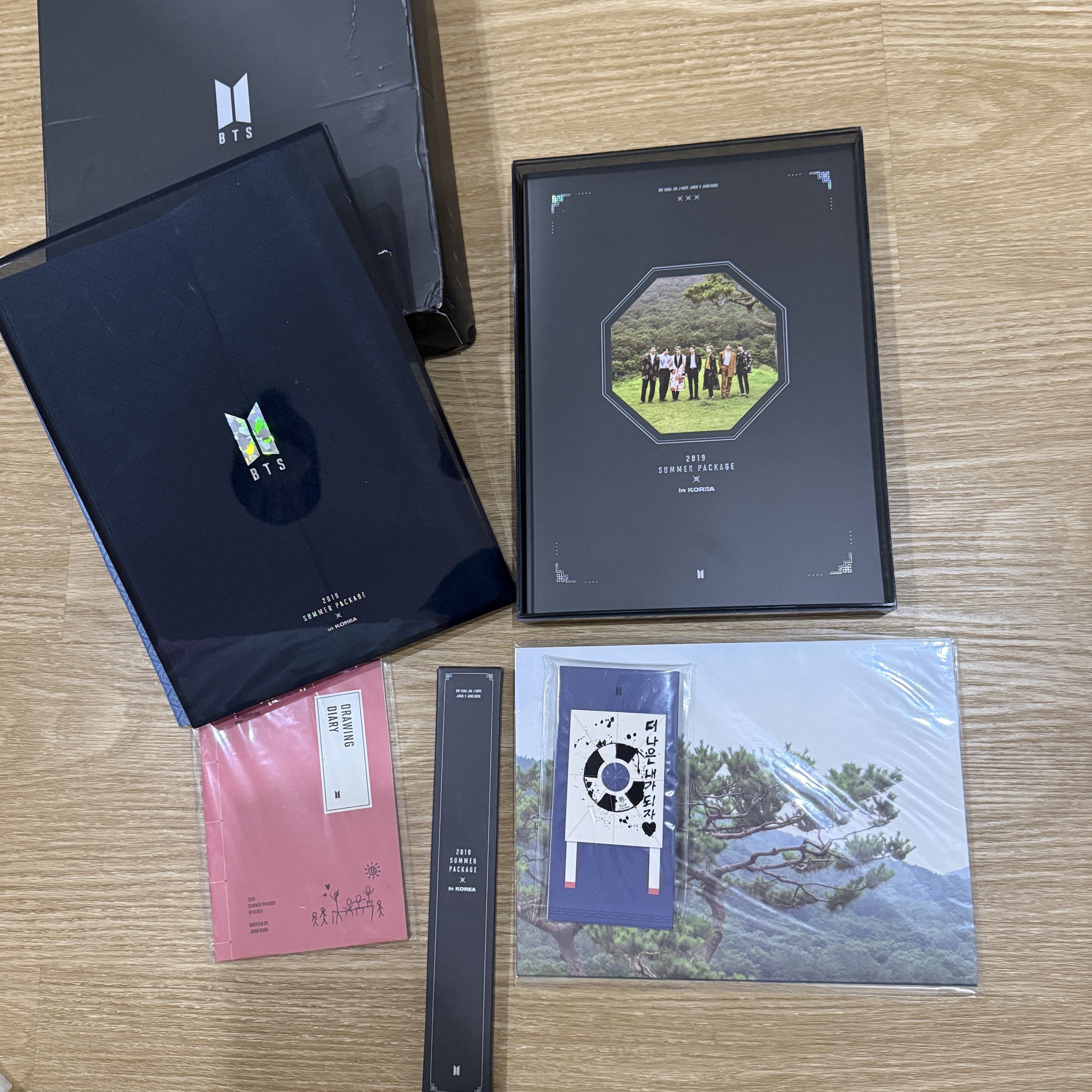 BTS 2019 Summer Package in Korea with Jungkook Diary (Category: K-Wave Merchandise) located in Cainta. Submitted by ac.decluttering (Listing ID 1418392005, Image 1). Description: BTS 2019 Summer Package in Korea with Jungkook Drawing Book - complete inclusions (outer box, acrylic case drawing diary, photobook, dvd, fan, folding screen, poster, mini poster) - unsealed - in good condition except for the outer box cause the material is hard to maint