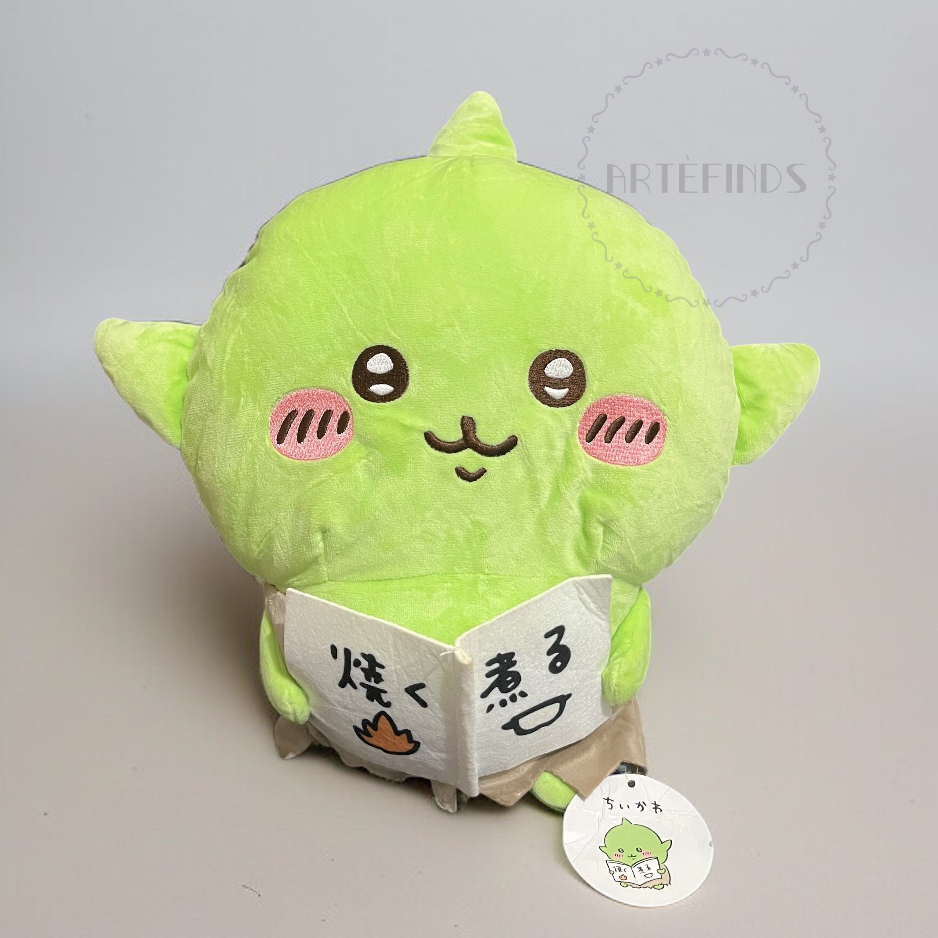 Chiikawa Goblin Plush - Holding Book ver (Category: Plushies & Soft Toys) located in Pasig City. Submitted by pinkfluff17 (Listing ID 1418384739, Image 2). Description: Adorable Chiikawa Goblin plush toy holding a book. Features embroidered details like rosy cheeks and a smiling face. Includes a tag with a cute illustration. Perfect for collectors or as a gift. Soft and huggable..