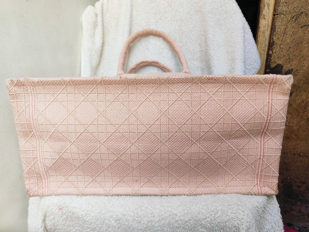 Christian Dior Book Tote Bag (Category: Luxury Bags & Wallets) located in Cebu City. Submitted by cherreymie70208 (Listing ID 1418240636, Image 3). Description: - Christian Dior Book Tote Bag - Lovely pink color - Features the Christian Dior logo - Made in Italy - Spacious interior - Unique textured exterior - Two top handles.