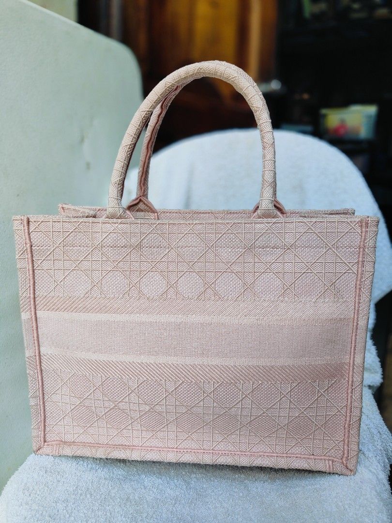 Christian Dior Book Tote Bag (Category: Luxury Bags & Wallets) located in Cebu City. Submitted by cherreymie70208 (Listing ID 1418240636, Image 2). Description: - Christian Dior Book Tote Bag - Lovely pink color - Features the Christian Dior logo - Made in Italy - Spacious interior - Unique textured exterior - Two top handles.