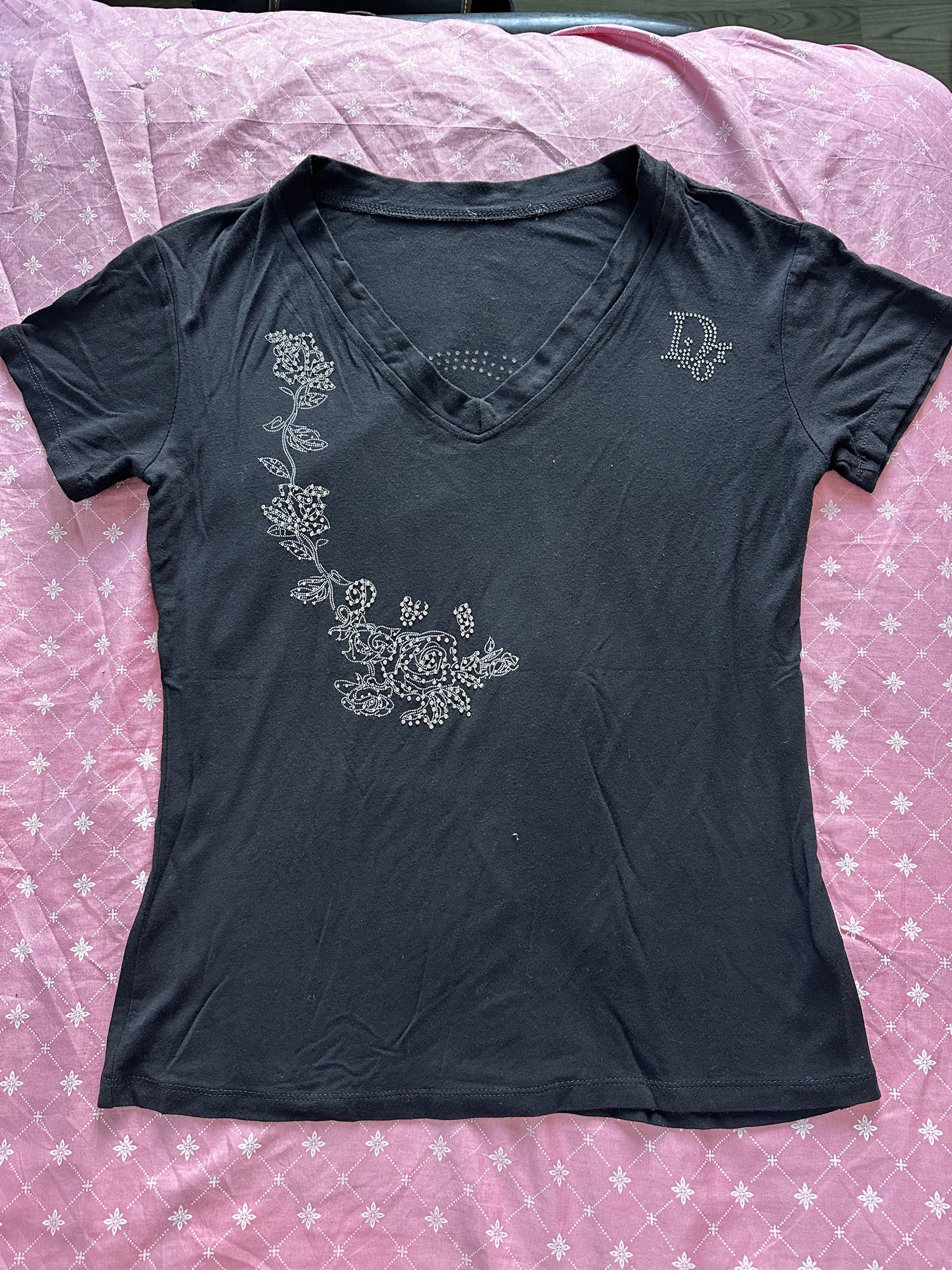 Christian Dior Rhinestone V-neck Top (Category: Shirts) located in San Fernando. Submitted by sandyayvii (Listing ID 1418281484, Image 1). Description: christian dior rhinestone v-neck top can fit small-medium (stretchy) has small pinhole at the back.