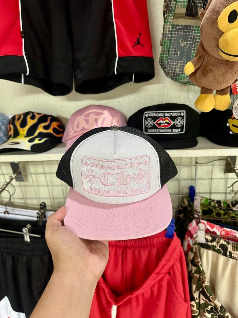Chrome Hearts Hollywood Camo Cap (Category: Caps & Hats) located in Cavite. Submitted by teamhd (Listing ID 1418289201, Image 2). Description: - Chrome Hearts Cap - Camouflage pattern with black mesh - Features Chrome Hearts Hollywood logo patch - Flat brim - Snapback closure - Also available: Pink brim cap with white patch.