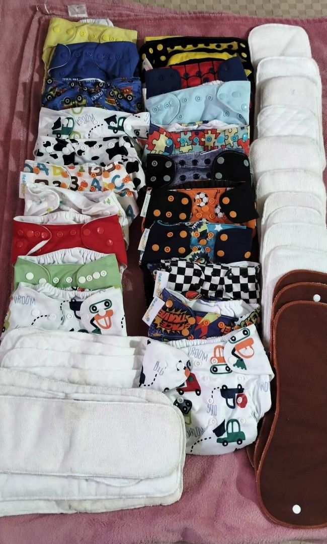 Cloth Diapers Set (Category: Diapers & Baby Wipes) located in Cabuyao City. Submitted by zaibern (Listing ID 1418355382, Image 1). Description: - Complete cloth diaper set - Features various colorful patterns (cars, animals, polka dots) - Includes multiple cloth diapers - Comes with inserts and absorbent pads - Ready for immediate use.