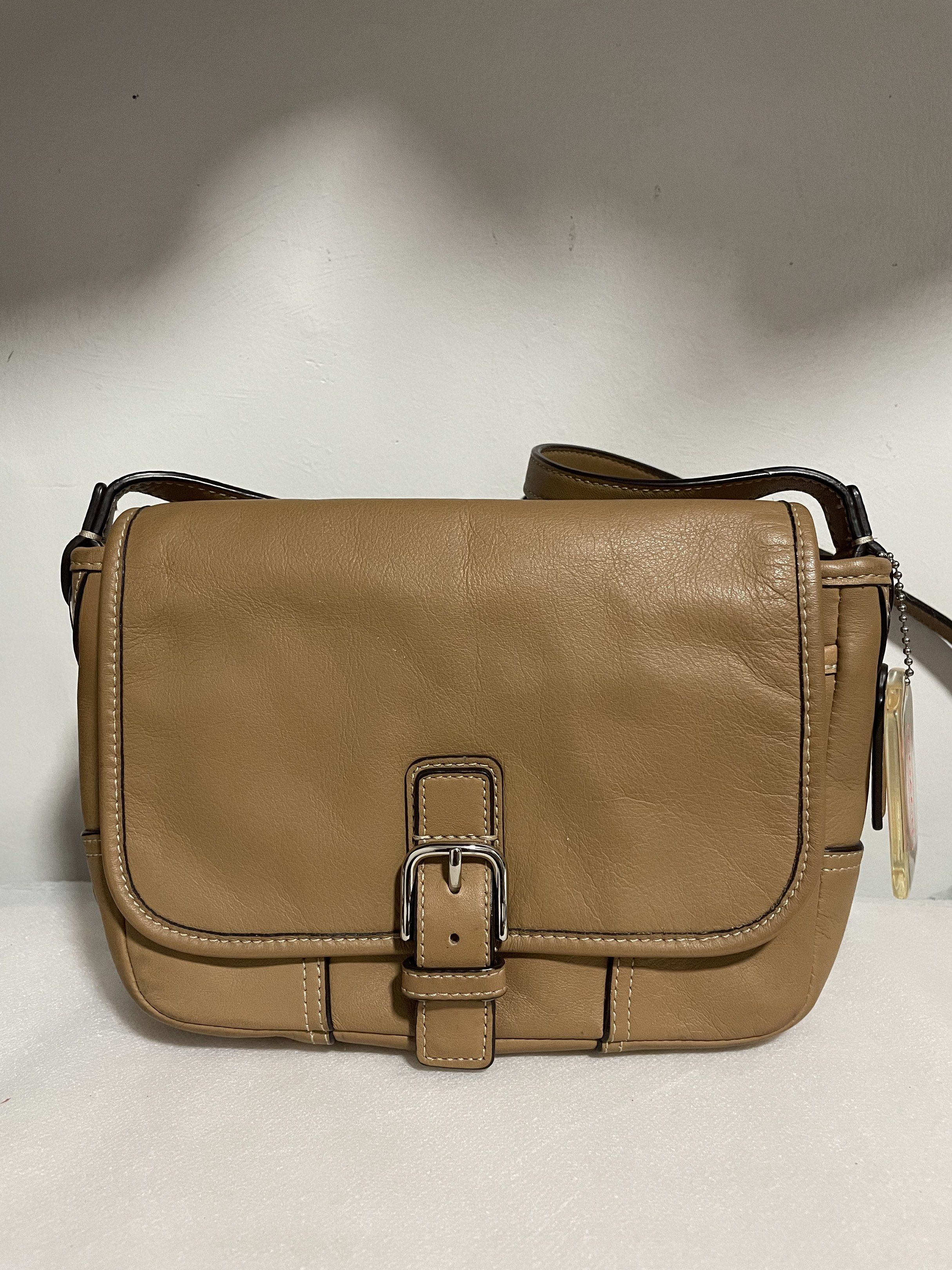 Coach Hadley Leather Field Shoulder Bag (Category: Luxury Bags & Wallets) located in Guiguinto. Submitted by prelovedinc2024 (Listing ID 1418376259, Image 1). Description: guaranteed authentic, bought in Japan with signs of use - creases, rubs on corners, some dirt on zip pocket silver hardwares - no tarnish but with hairlines very clean inside last photo is only for reference size: 8x5.5x2” - Coach Hadley shoulder bag - Camel color - Flap closur