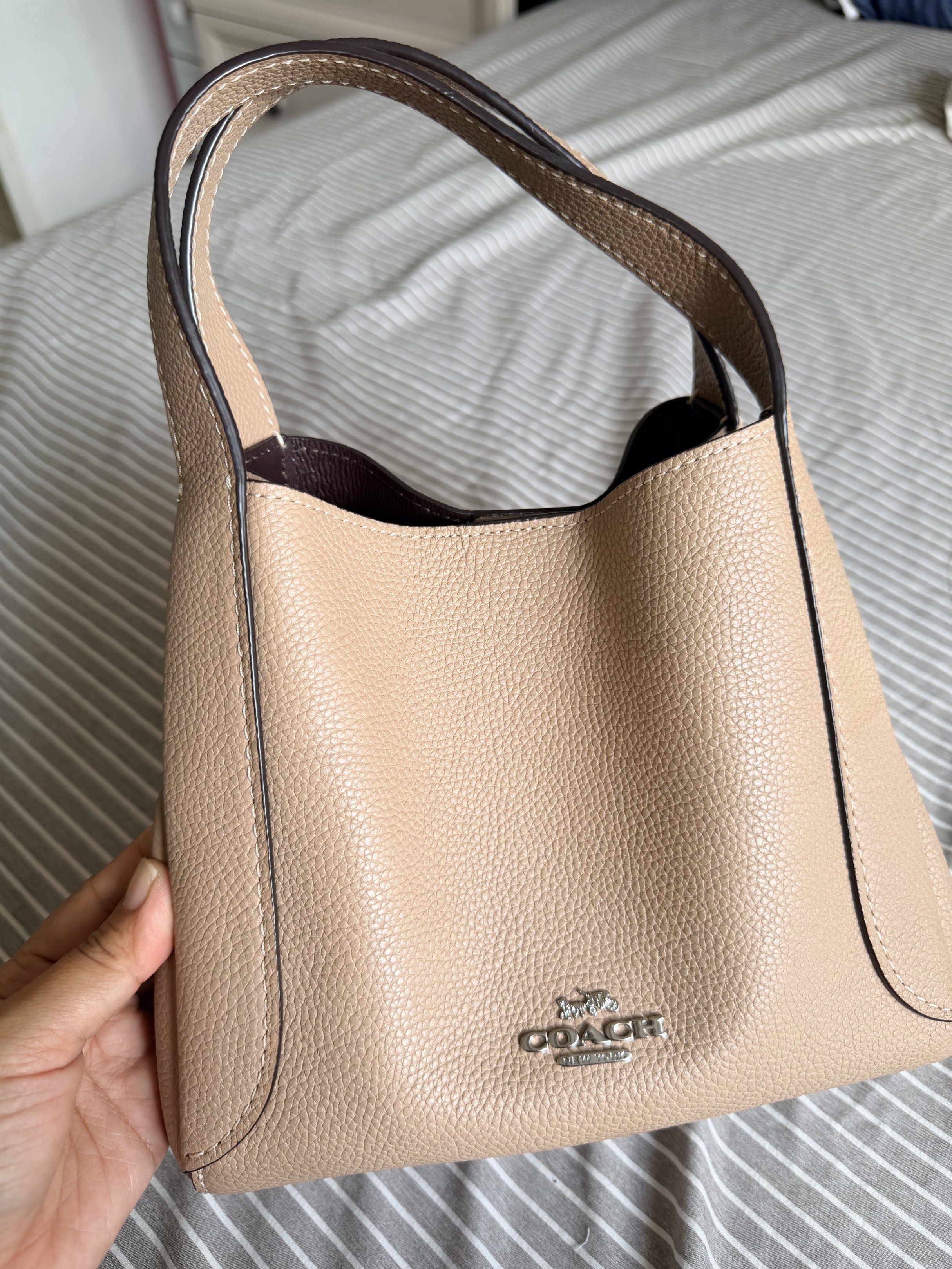 Coach Pebbled Leather Hobo Bag (Category: Luxury Bags & Wallets) located in Baler. Submitted by lalaloves_ (Listing ID 1418274682, Image 2). Description: - Authentic Coach handbag - Pebbled leather exterior - Detachable shoulder strap - Dark brown interior lining - Interior pocket - Top handle - Silver Coach logo - Made in Vietnam.