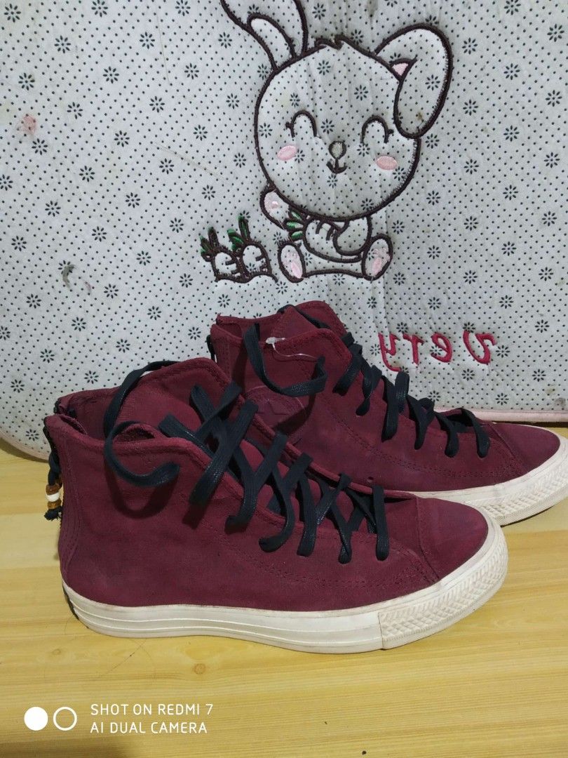 Converse Chuck Taylor All Star High Top Sneakers (Category: Sneakers) located in Manila. Submitted by cyj08 (Listing ID 1418276809, Image 1). Description: - Maroon Converse Chuck Taylor All Star high-top sneakers - High-top design - Black laces - White sole - Converse logo on the side - Suede-like texture - Zipper detail at the back.
