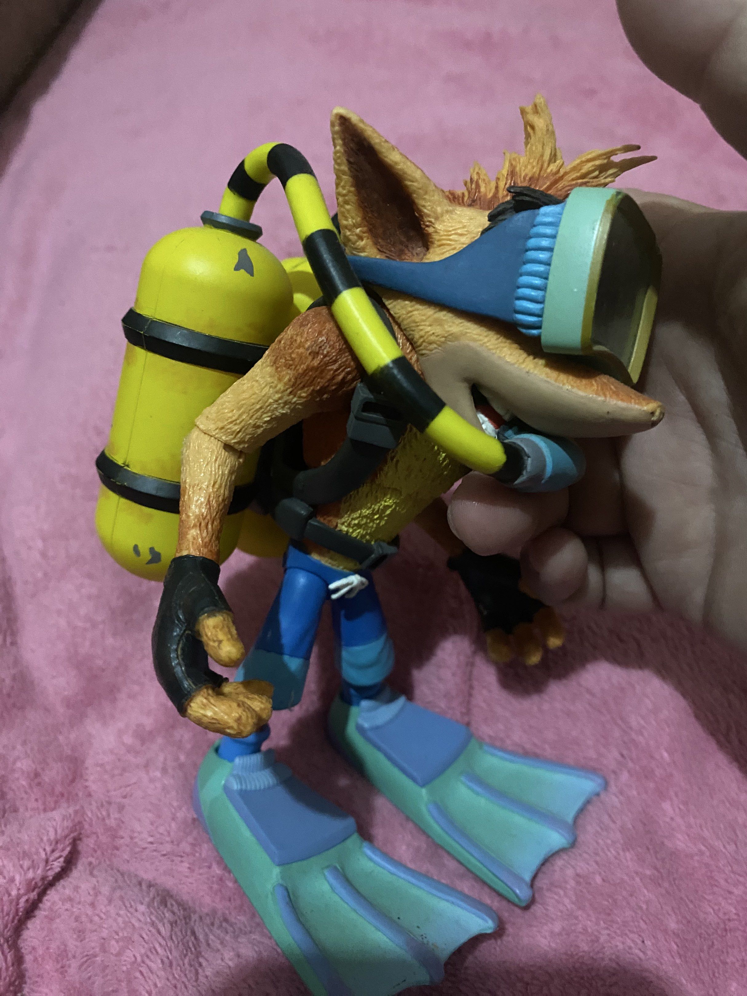 Crash Bandicoot Scuba Diving Figure (Category: Figurines & Statues) located in Manila. Submitted by nino2 (Listing ID 1418397966, Image 2). Description: - Crash Bandicoot figure in scuba gear. - Includes diving mask, air tanks, and flippers. - Painted in vibrant colors. - Features articulated joints. - Great collectible for Crash Bandicoot fans. Issue missing nose.