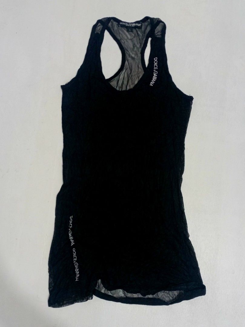 Dolce & Gabbana Racerback Black Tank Top (Category: Luxury Apparel) located in Manila. Submitted by eriiicaspage (Listing ID 1418297028, Image 1). Description: PreOwned ,likeNew Lightly Used Dolce & Gabbana tank top -XS-Small - Black color - Racerback design - Features brand logo - Sheer,at the back - lightweight fabric - Scoop neck Off/legit. No guaranty sa Authenticity Good Condition 9/10.