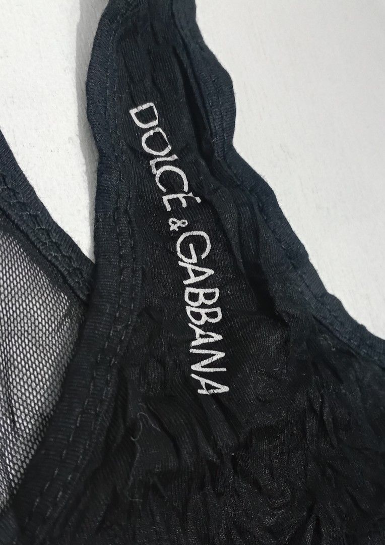 Dolce & Gabbana Racerback Black Tank Top (Category: Luxury Apparel) located in Manila. Submitted by eriiicaspage (Listing ID 1418297028, Image 3). Description: PreOwned ,likeNew Lightly Used Dolce & Gabbana tank top -XS-Small - Black color - Racerback design - Features brand logo - Sheer,at the back - lightweight fabric - Scoop neck Off/legit. No guaranty sa Authenticity Good Condition 9/10.