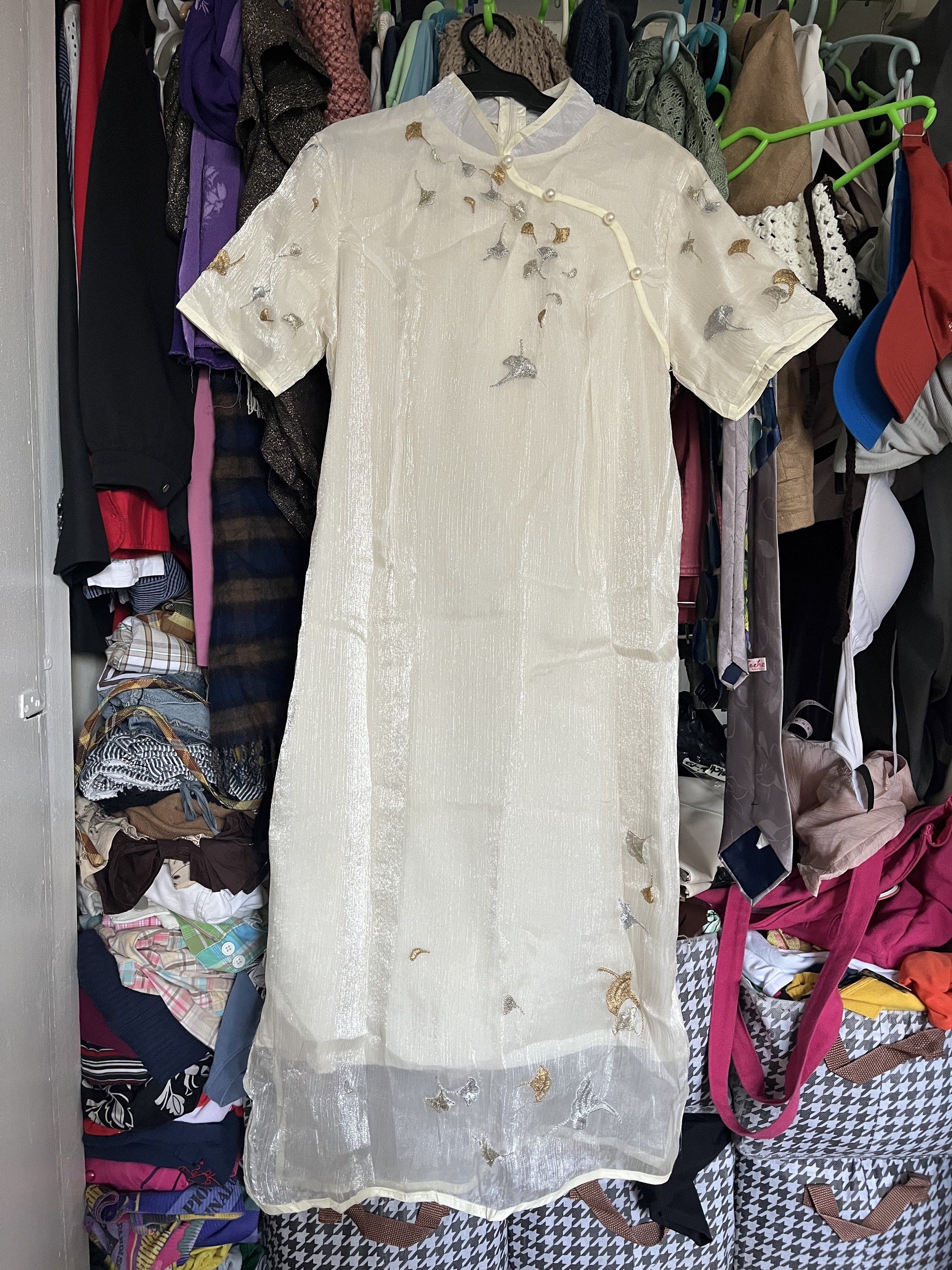Embroidered Cheongsam Dress (Category: Dresses) located in Quezon City. Submitted by mel.highmoons (Listing ID 1418286420, Image 1). Description: Sobrang ganda! For small to semi large. Measurement in inches (laid flat): 17 waist 17 bust 43 length MOP: Gcash/BPI/Bank Transfer MOD: Lalamove, Flash Express Shipping fee to be shouldered by buyer. - Cream-colored cheongsam dress, Delicate embroidery with silver and gold accents, Mandarin collar, Pear