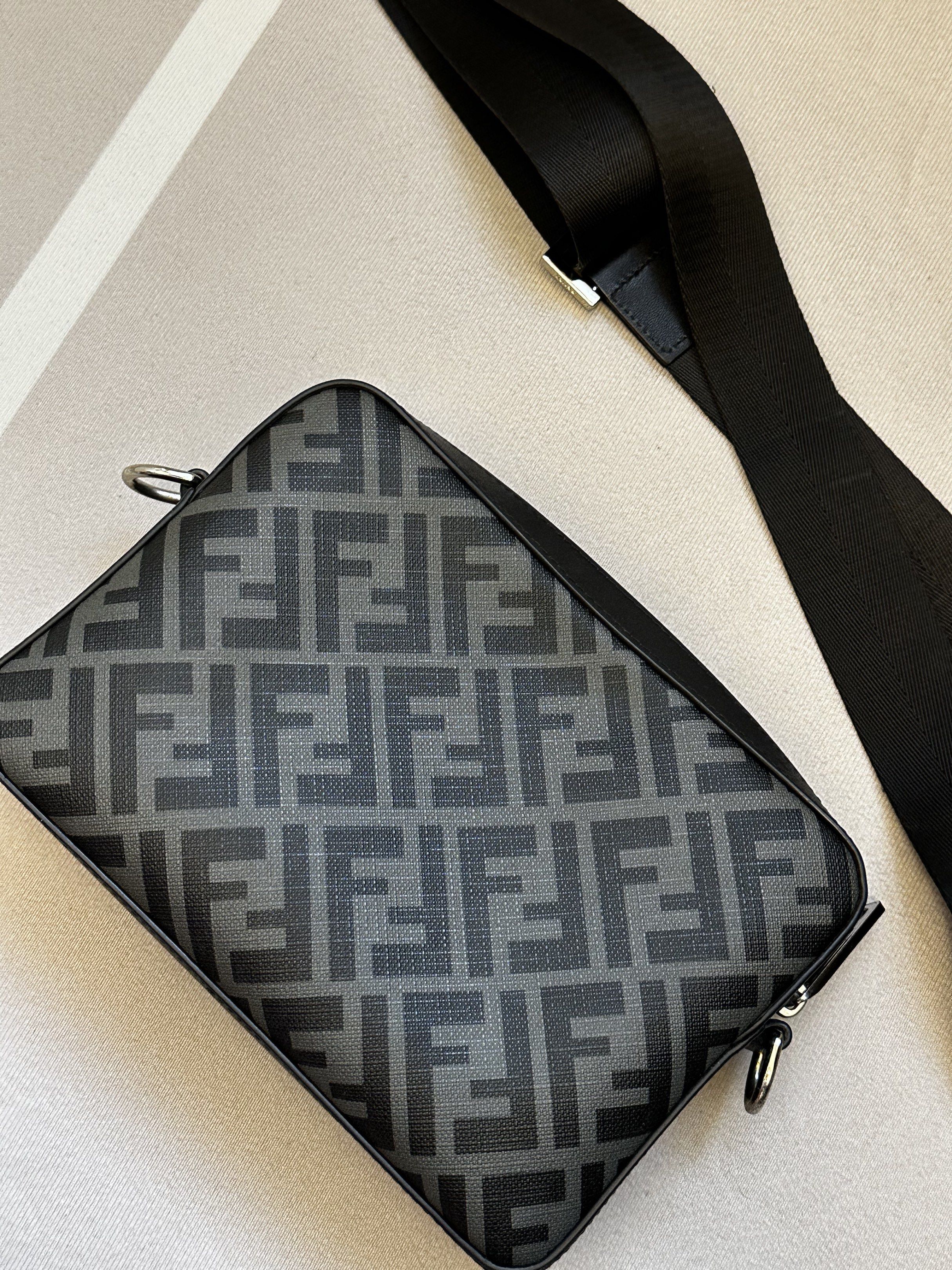 Fendi Crossbody Bag (Category: Luxury Bags & Wallets) located in Masbate. Submitted by used_bags (Listing ID 1418273822, Image 3). Description: - Fendi Camera Bag - Iconic FF motif design - Eye-catching yellow stripe - Adjustable black strap - Silver-tone hardware - Secure zip closure - Interior: Black with Fendi Roma label - Exterior: FF pattern with black leather panel NO COD MOP: Gcash or Bank Transfer.
