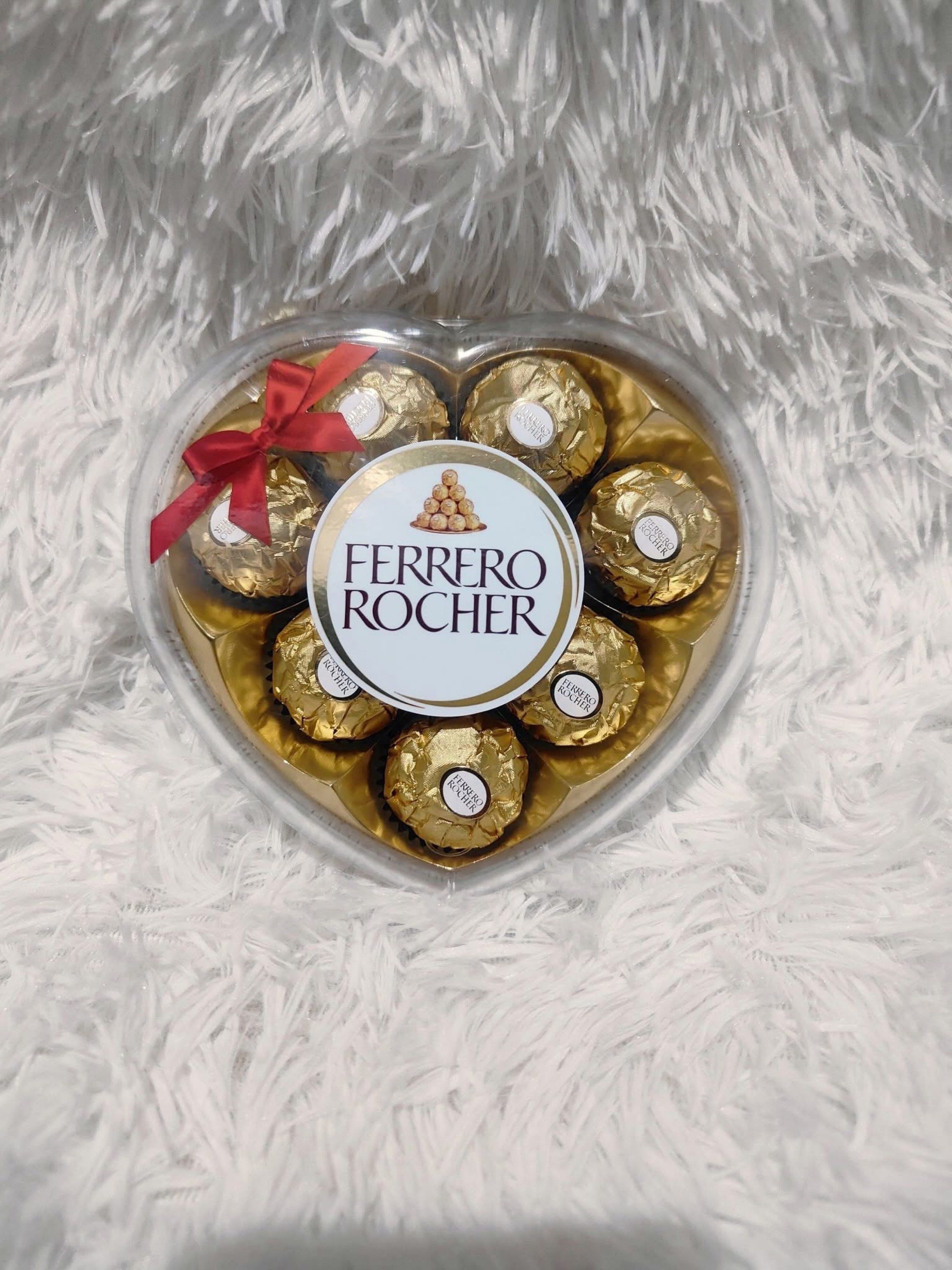 Ferrero Rocher Heart-Shaped Box (Category: Other Food & Drinks) located in Manila. Submitted by kiarashopstore (Listing ID 1418233986, Image 1). Description: - Heart-shaped box of Ferrero Rocher chocolates - Contains individually wrapped chocolates - Each chocolate has a golden wrapper - Features a decorative red ribbon - Perfect for gifting or personal indulgence.