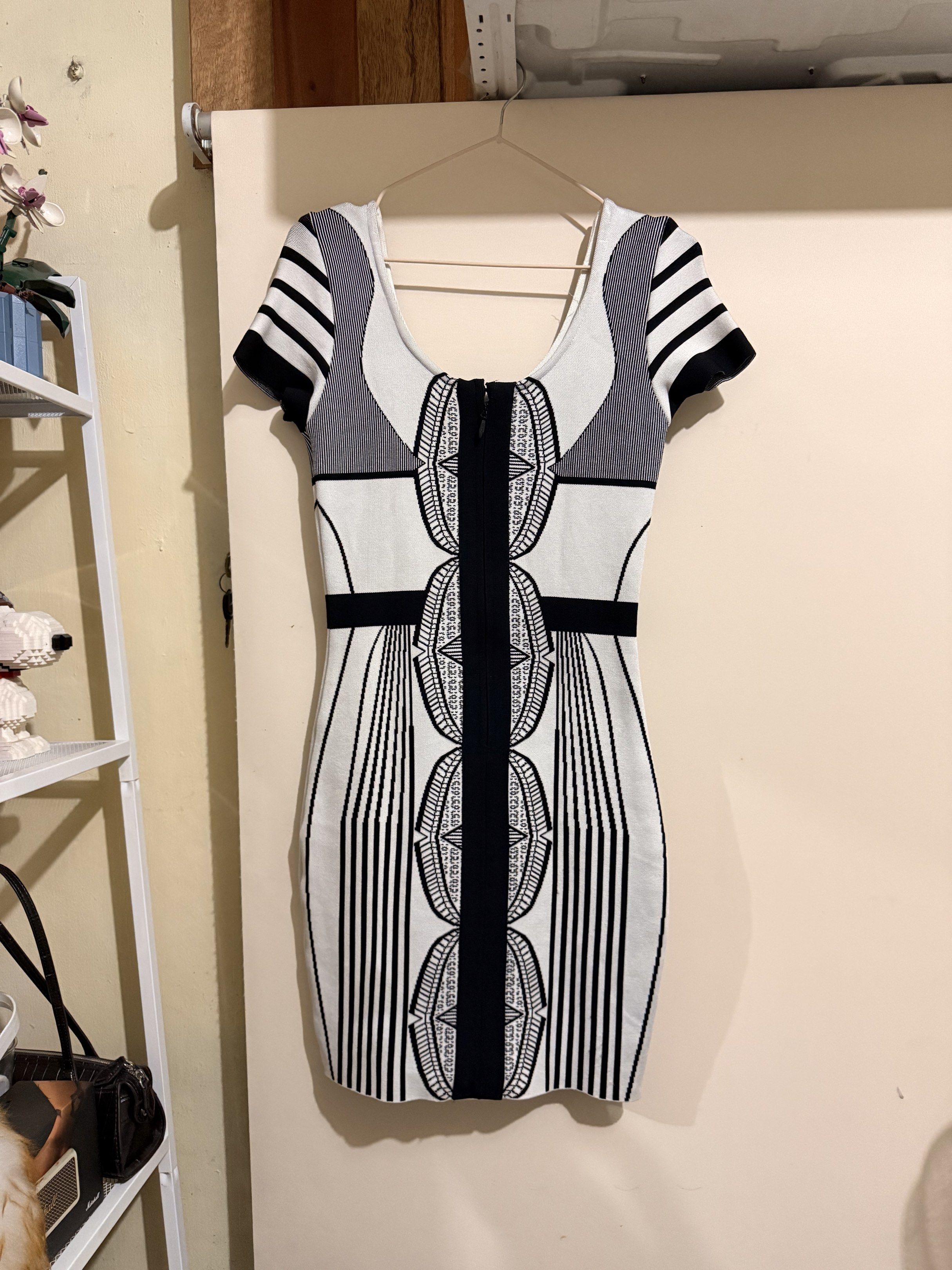 Herve Leger Bandage Dress (Category: Dresses) located in Valenzuela. Submitted by i_flauntph (Listing ID 1418347476, Image 3). Description: - Herve Leger bandage dress - Fits Medium - Bodycon - Scoop neckline - Short sleeves - Black, white, and gray geometric pattern - Zipper closure.