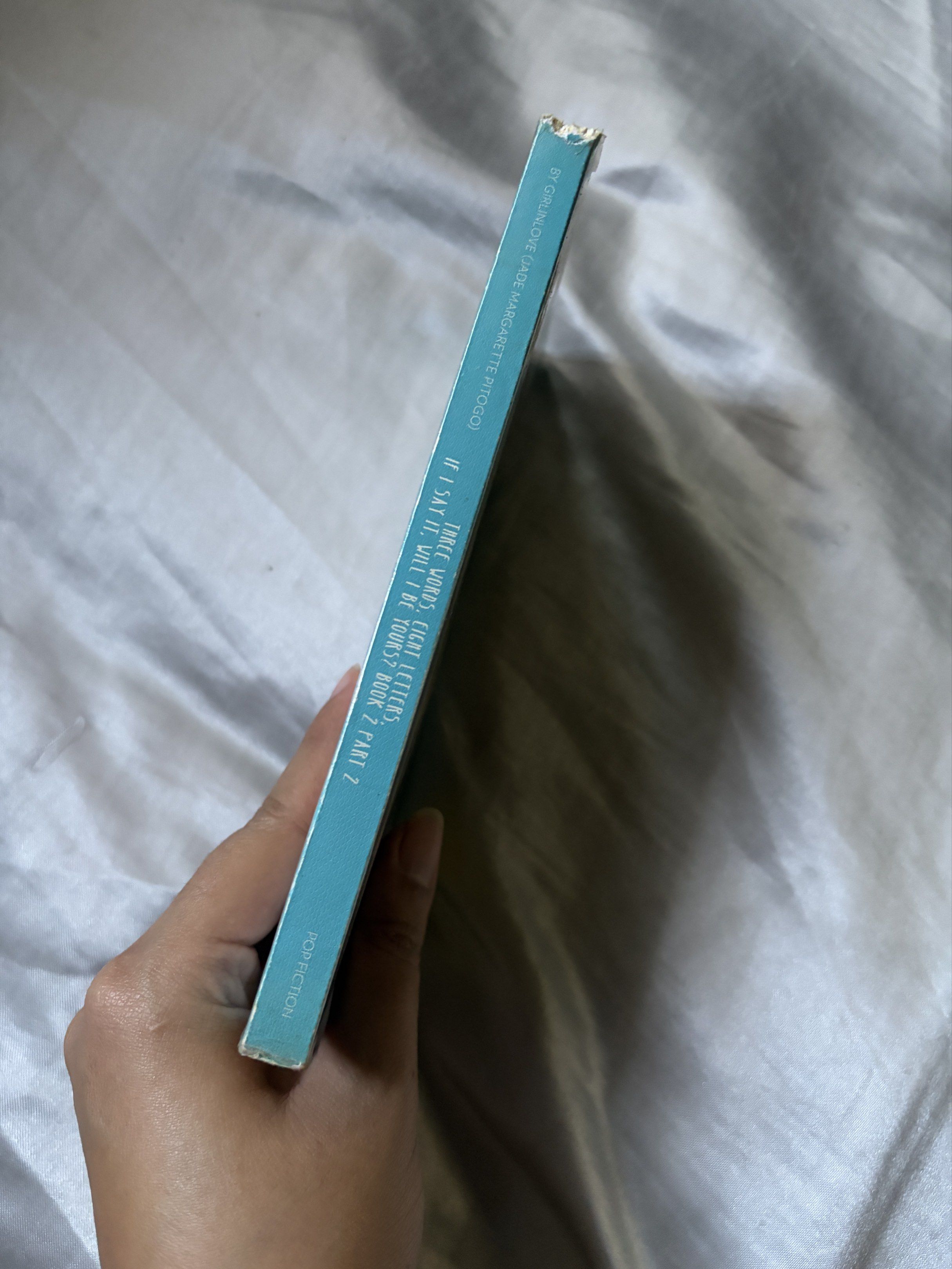 If I Say It, Will I Be Yours? Book 2 (Popfic) (Category: Storybooks) located in Quezon City. Submitted by czcsp (Listing ID 1418326355, Image 3). Description: - "If I Say It, Will I Be Yours?" Book 2 by Girlinlove - Published by Pop Fiction (Wattpad) - Romantic cover design - Shows some wear and tear on the spine - Includes a brief story summary on the back cover.