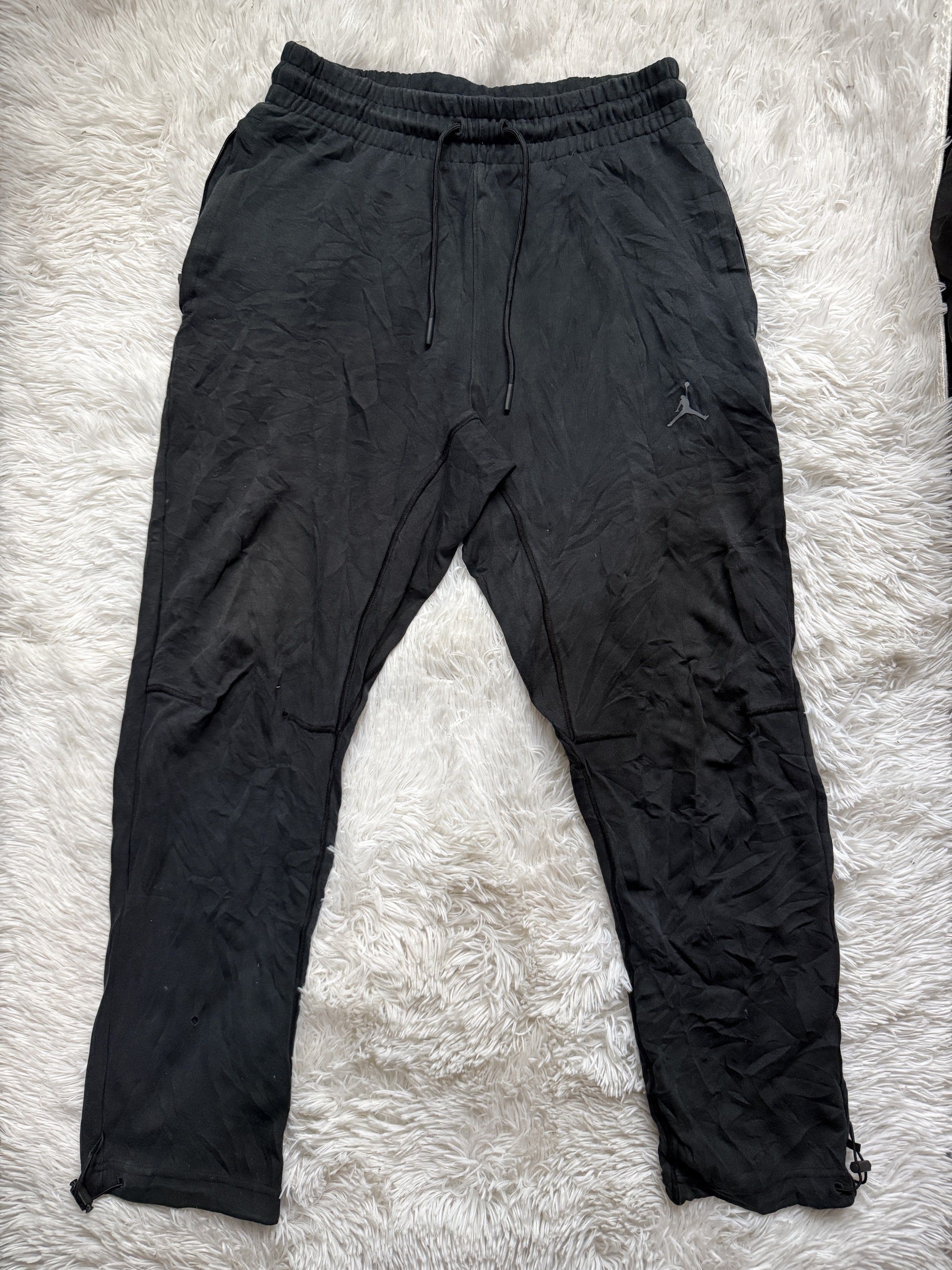 Jordan Dri-FIT Black Pants - Size M (Category: Joggers) located in Manila. Submitted by keepercollection (Listing ID 1418209744, Image 1). Description: - Black Jordan Dri-FIT pants - Size: M - Features: Jumpman logo, NBA patch, drawstring waistband, zippered ankles - Relaxed fit - Comfortable material - Made in China - Perfect for casual wear and workouts.
