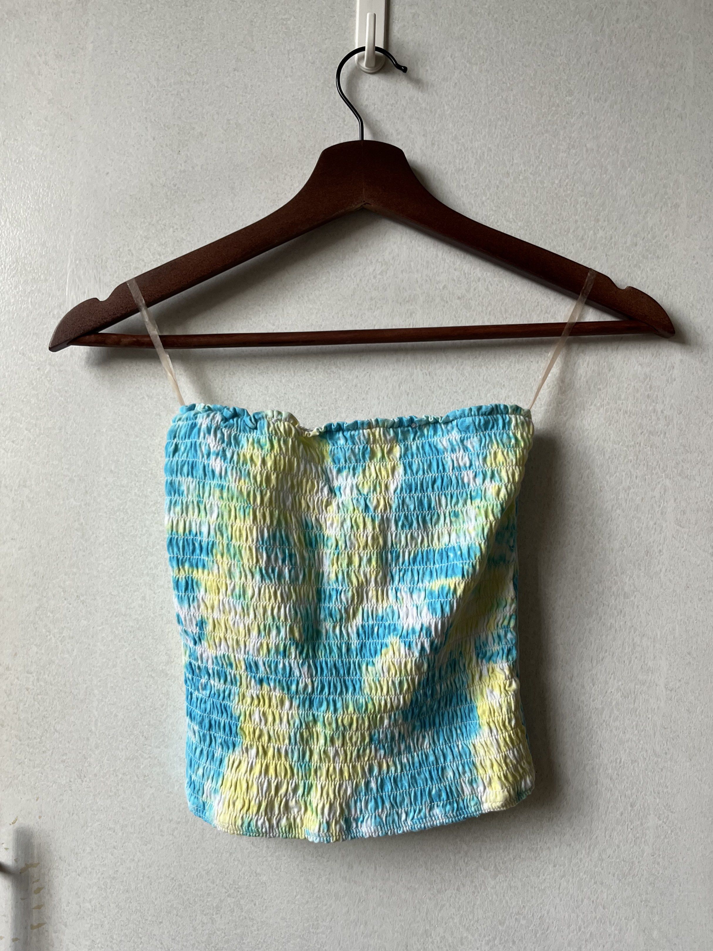 Justice Tie-Dye Tube Top (Category: Others Tops) located in Pasig City. Submitted by papainyourhead (Listing ID 1418376497, Image 1). Description: - Justice tube top - Features a vibrant blue and yellow tie-dye pattern - Size: XXS-S - Material: 95% cotton, 5% elastane.