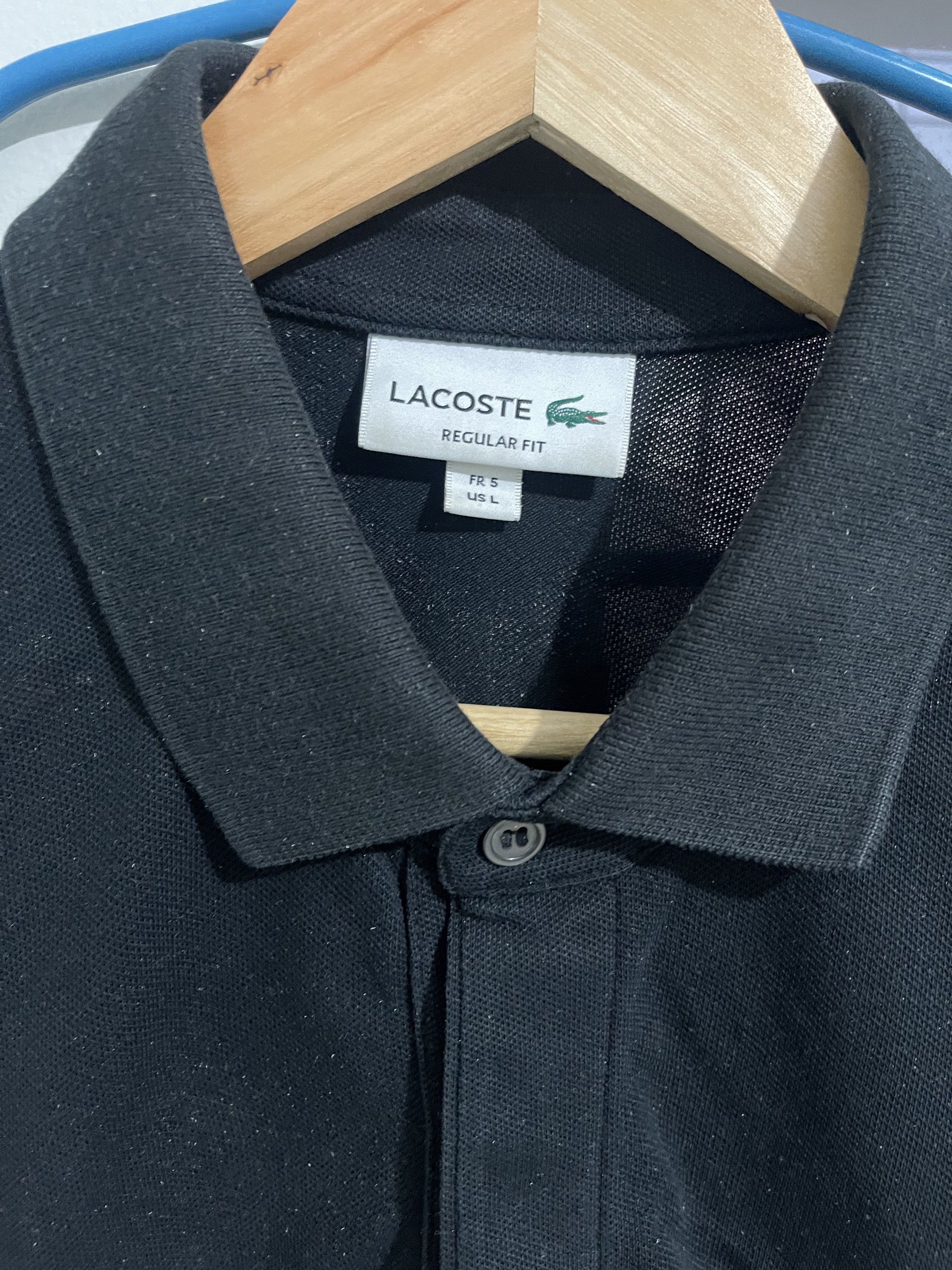 Lacoste Monotone Polo Shirt Large (Category: Tshirts & Polo Shirts ) located in Batangas. Submitted by jomajomastuff (Listing ID 1418315904, Image 3). Description: FOR SALE ‼️‼️‼️ Lacoste Polo shirt Monotone (Black) Size large on tag, regular fit 100% authentic 28 length, 21 width Excellent condition Color rate 9.5/10 Color may vary due to camera and lighting No issue: need wash lang kasi na stock pero overall black na black ₱1400 Lima Batangas L