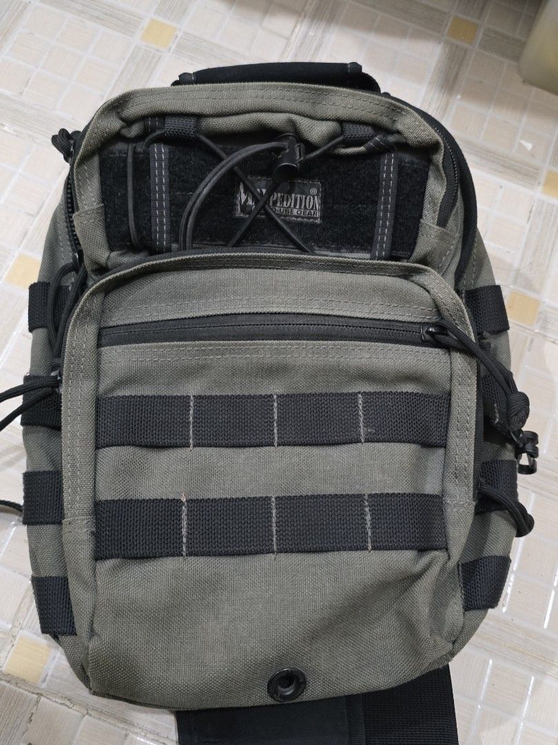 Maxpedition American Design Sling Bag (Category: Sling Bags) located in Dasmarinas. Submitted by ildnumde (Listing ID 1411827183, Image 1). Description: - Maxpedition Lunada sling bag - wolf grey colorway - Features a mesh back panel for breathability - Adjustable straps for a comfortable fit - Multiple compartments for organization - Includes attachment points for accessories - Durable construction - American design, made in Taiwan - Suitable fo