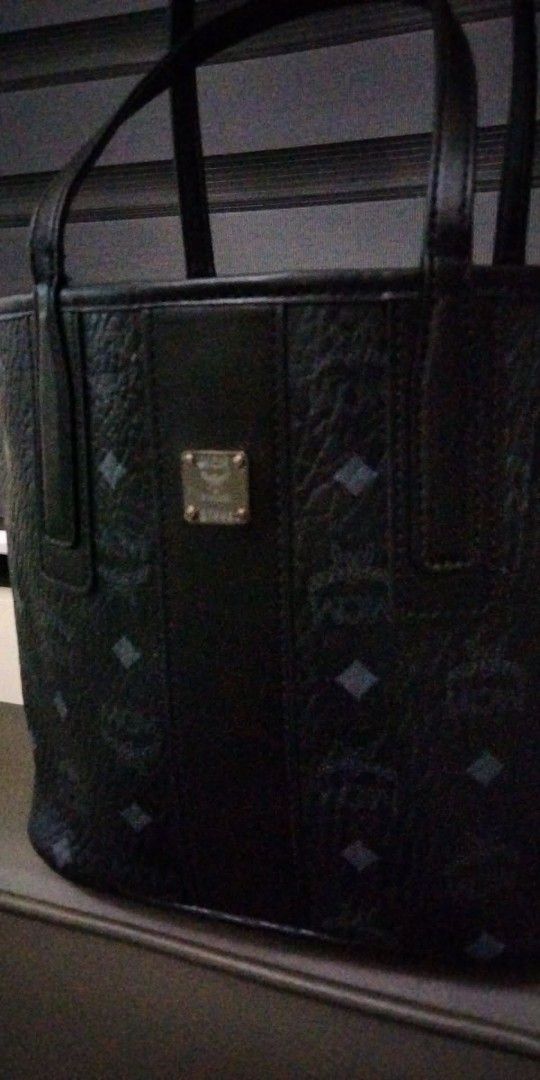 SOLD 👈 MCMC Black Tote Bag (Category: Luxury Bags & Wallets) located in Cabanatuan. Submitted by almaespino24263 (Listing ID 1418328690, Image 3). Description: - Black MCM tote bag - Diamond pattern - Top handle design - Rectangular shape - Repeating interior lining pattern - Small interior pocket - Gold-colored MCM logo.