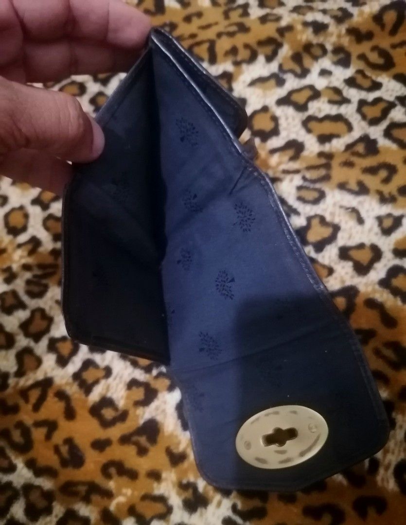 Mulberry Leather Wallet (Category: Luxury Bags & Wallets) located in Cebu City. Submitted by roadthrift (Listing ID 1418353883, Image 3). Description: Mulberry leather wallet in navy blue. It features a flap closure with a metal clasp. The interior includes multiple card slots and a coin compartment. The Mulberry logo is visible inside the wallet..