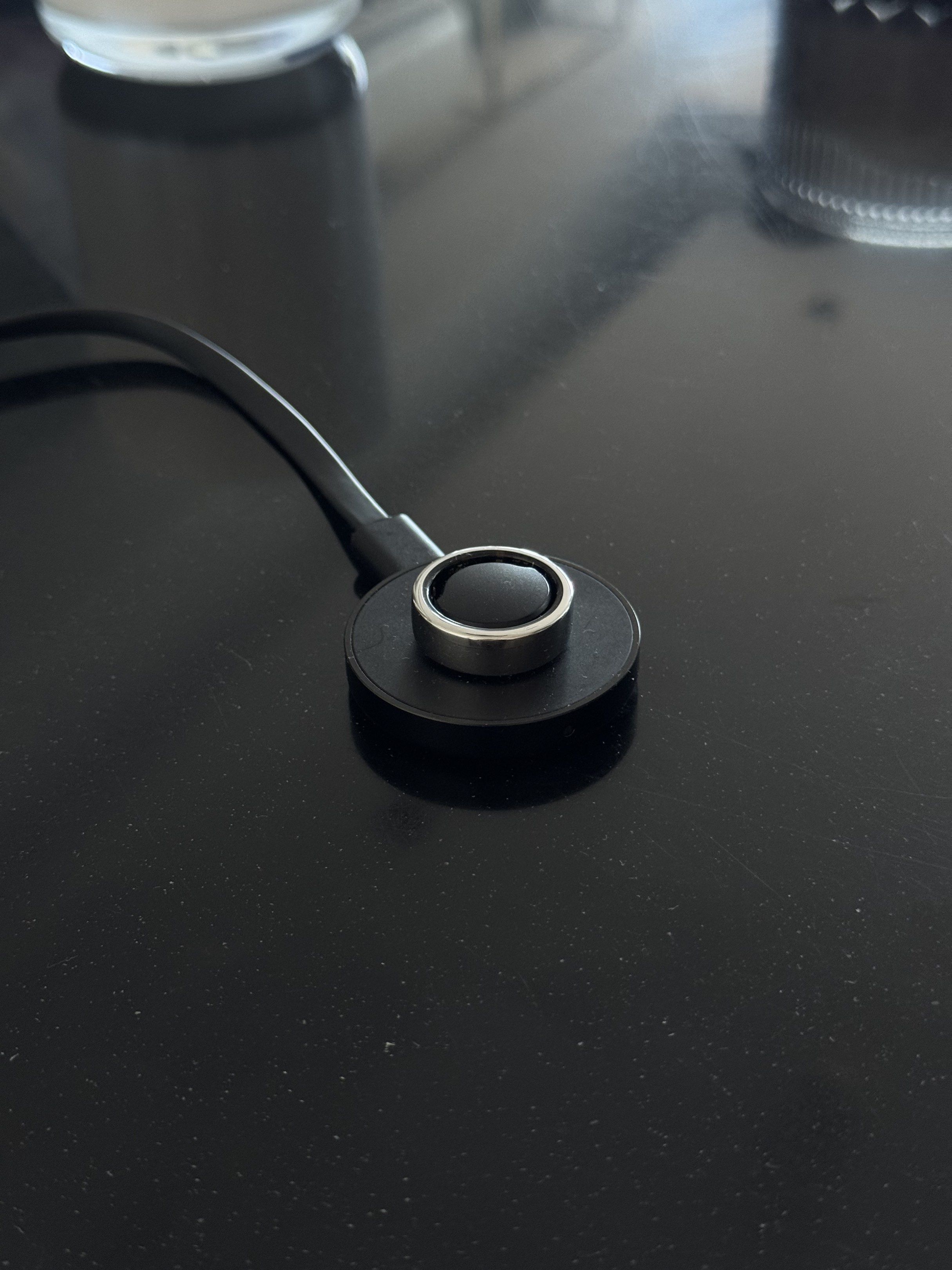 Oura Ring Gen 2 Silver Size 10 (Smart Ring with Charger) (Category: Sports & Fitness Nutrition) located in Makati City. Submitted by _btdeclutters (Listing ID 1418299866, Image 2). Description: - Smart ring with a modern, sleek design - Comes with a charging dock - Ring features a silver band - Charger is black and circular - Likely used for tracking health metrics - Well used, with visible scratches but 100% smooth no issue.
